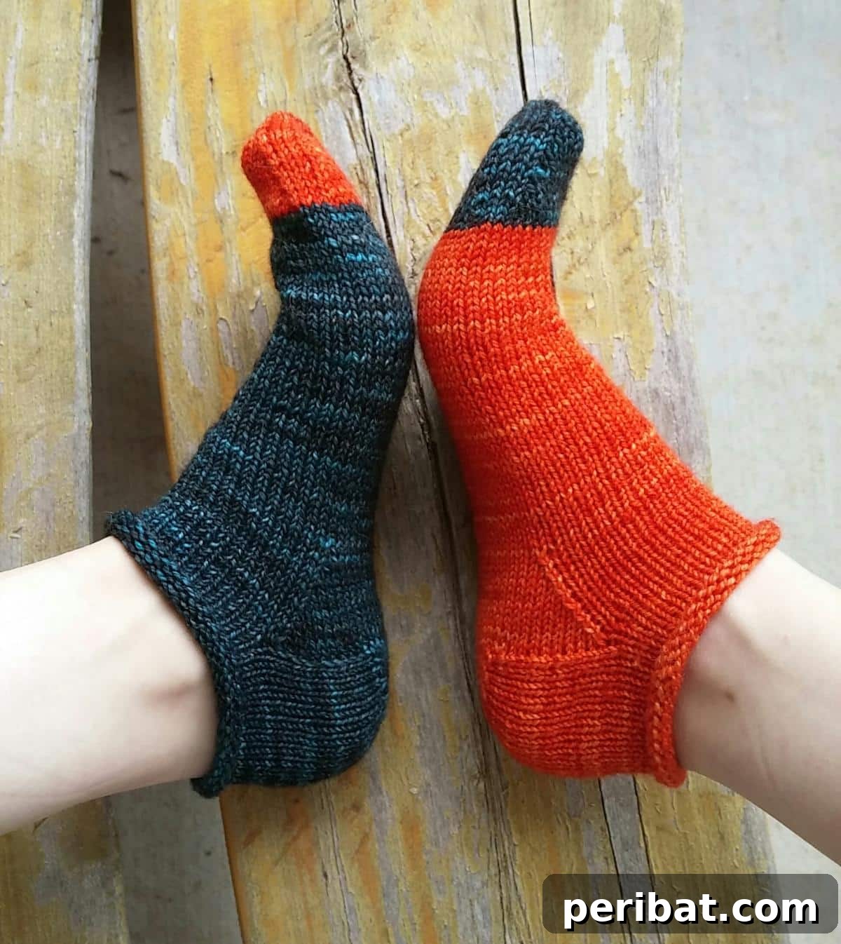 38 Cozy Sock Knitting Patterns 5 Vibrant Rose City Roller Socks with a distinctive roll-top cuff.