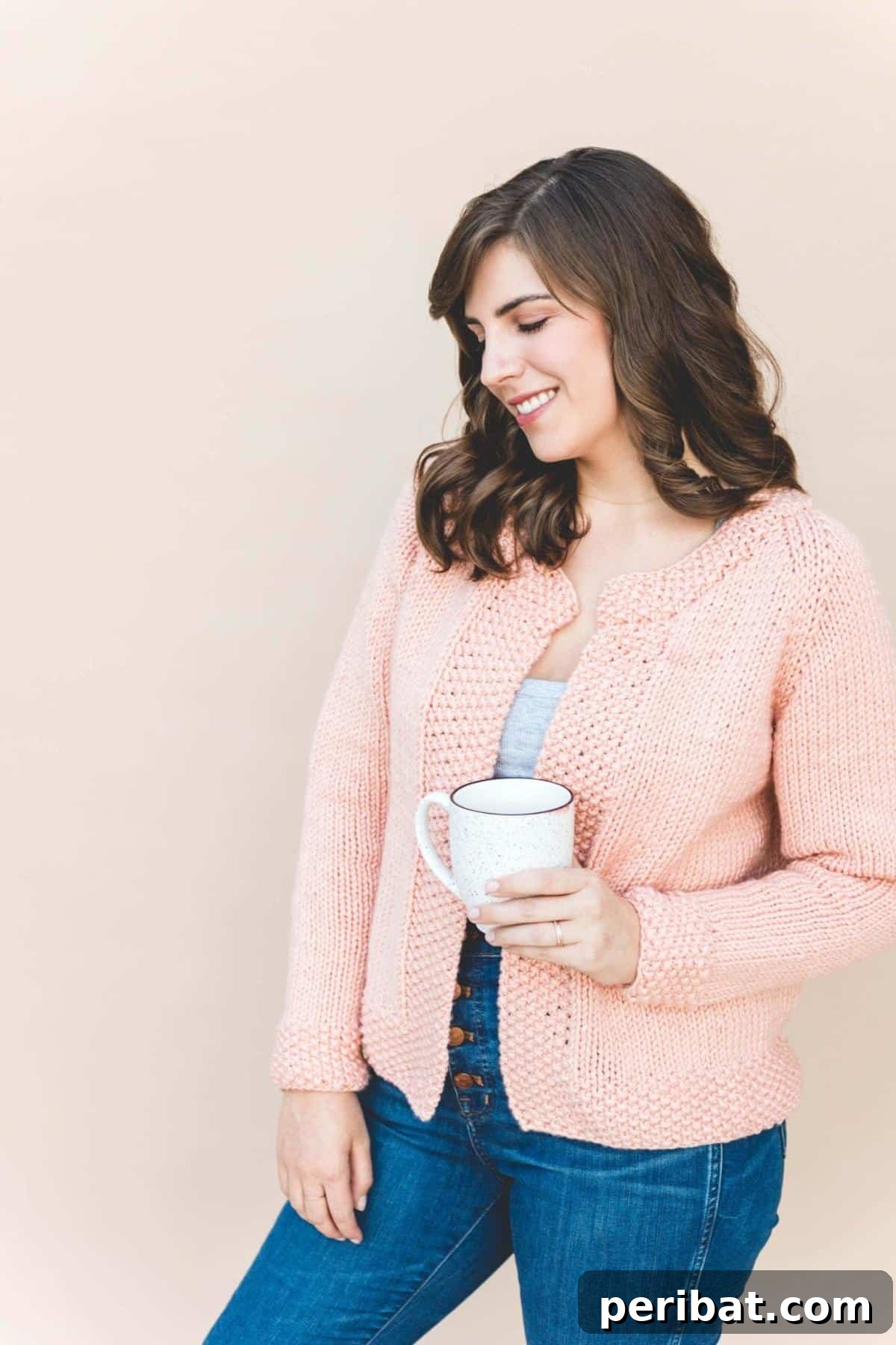 The Knit Betty Cardigan, a stylish piece blending retro charm with modern aesthetics, featuring ribbed details.