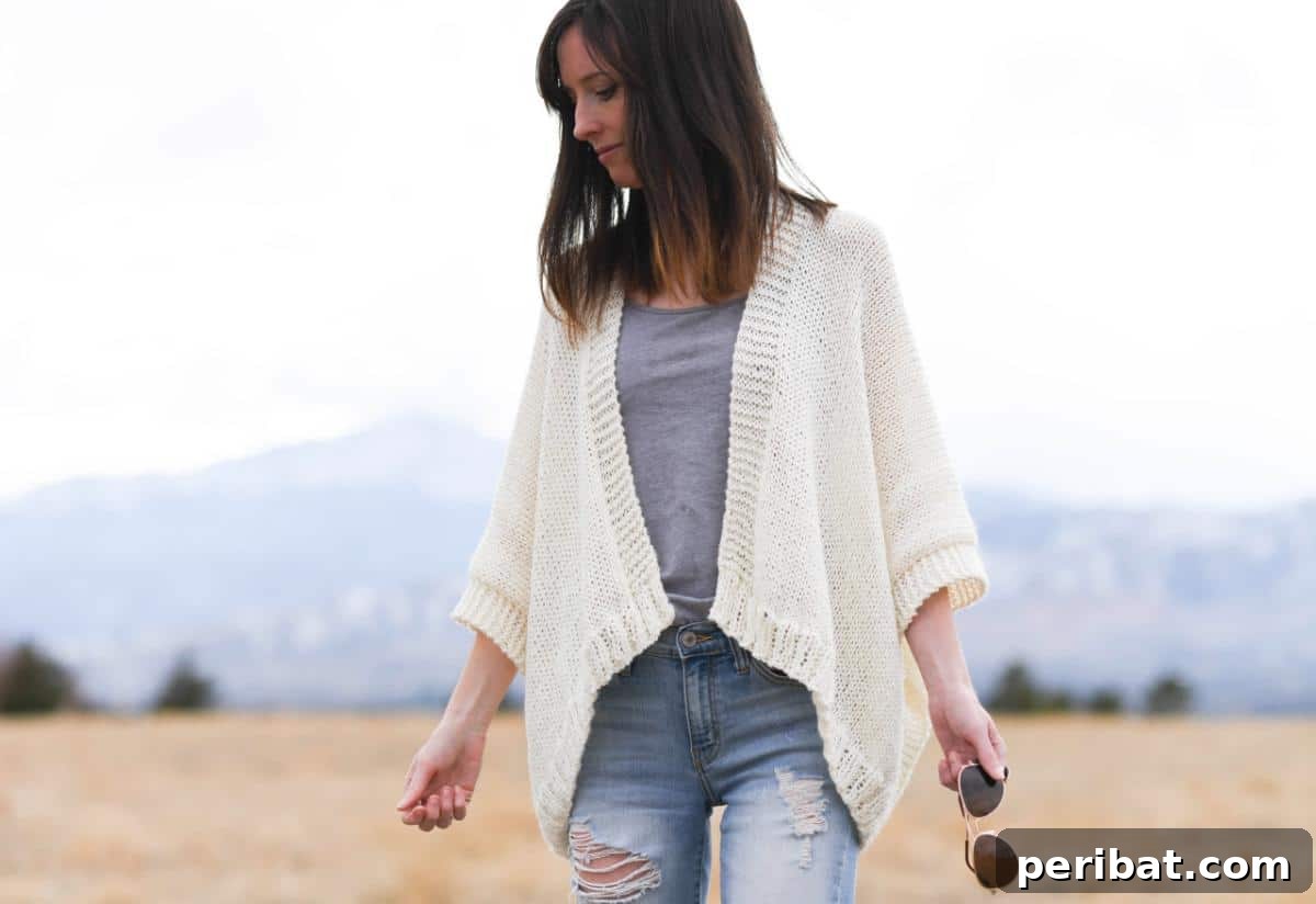 The elegant Breckenridge Knit Topper Cardigan featuring an open-front design and intricate lace details.