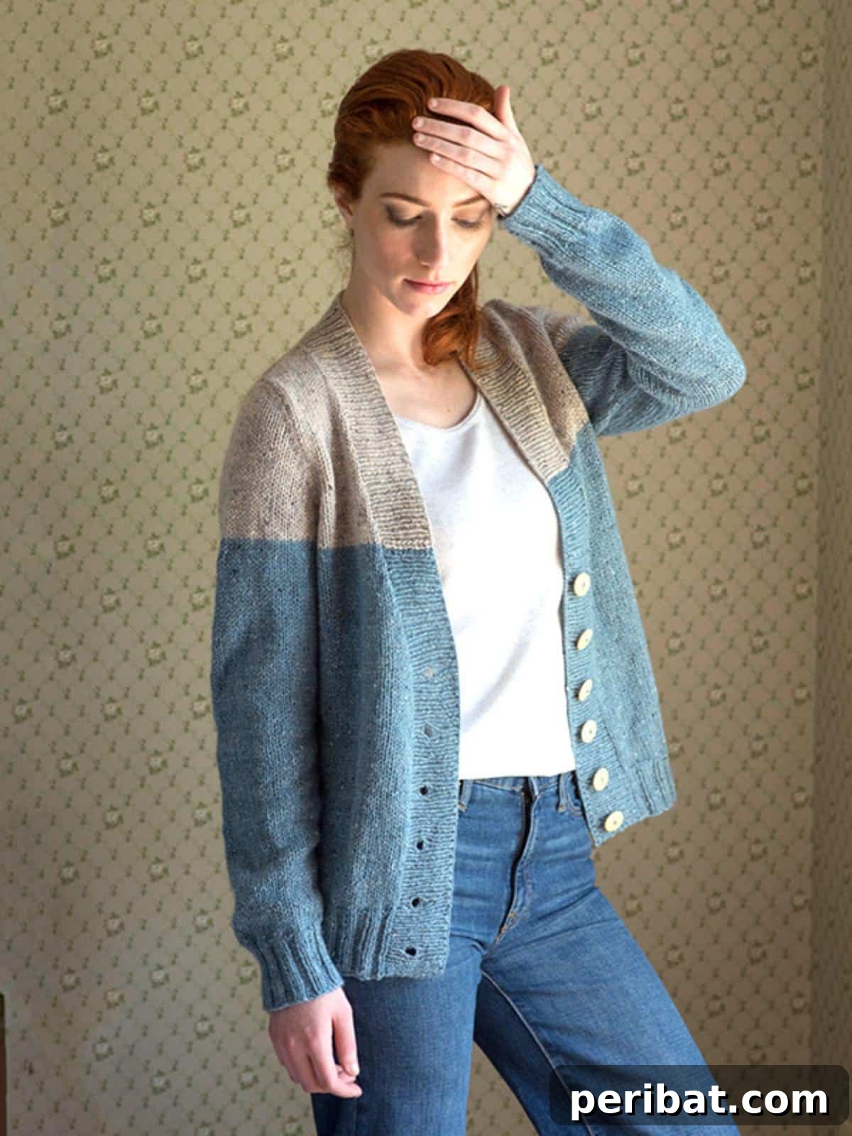 The Estuary Cardigan, an elegant V-neck design with ribbed patterns, showcasing a flattering open-front silhouette.