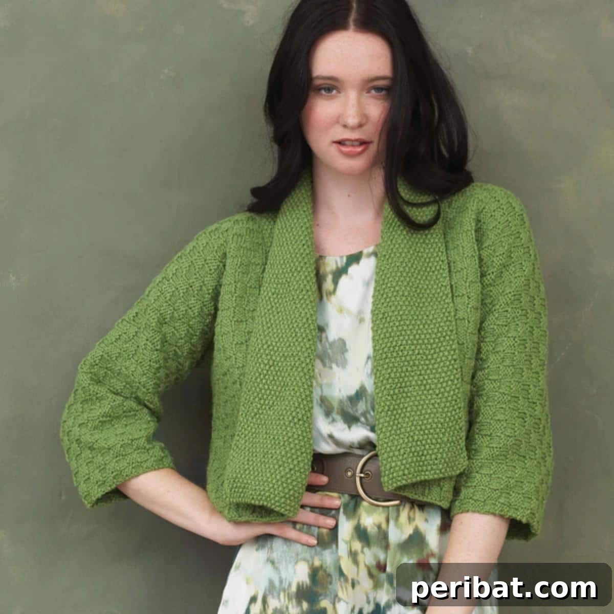 A model wearing the Bernat Kimono Sleeve Knit Cardigan, highlighting its distinctive wide sleeves and relaxed fit.