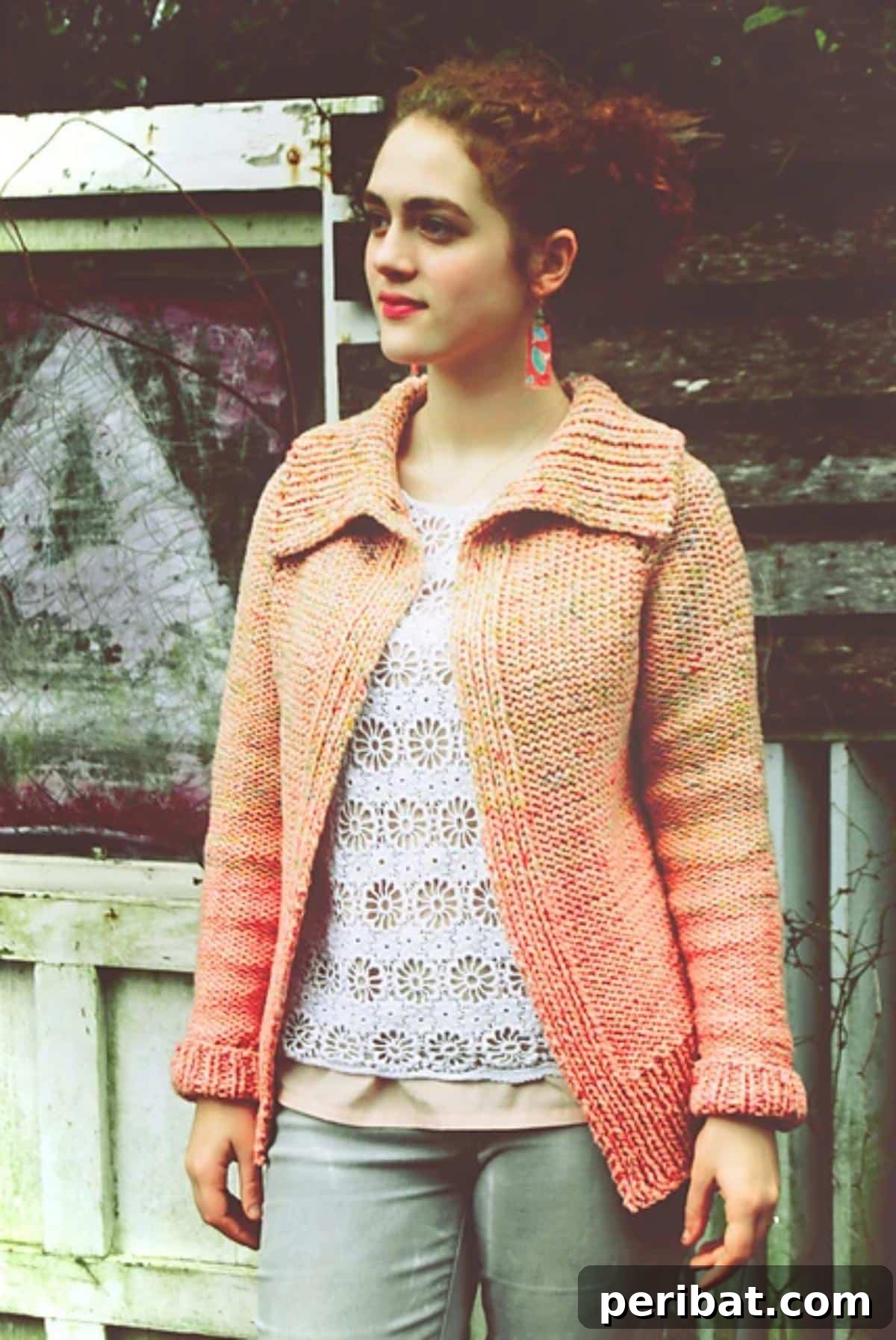A woman wearing a stylish Asheville cardigan with a collared design and subtle color fade, showcasing modern knitwear.