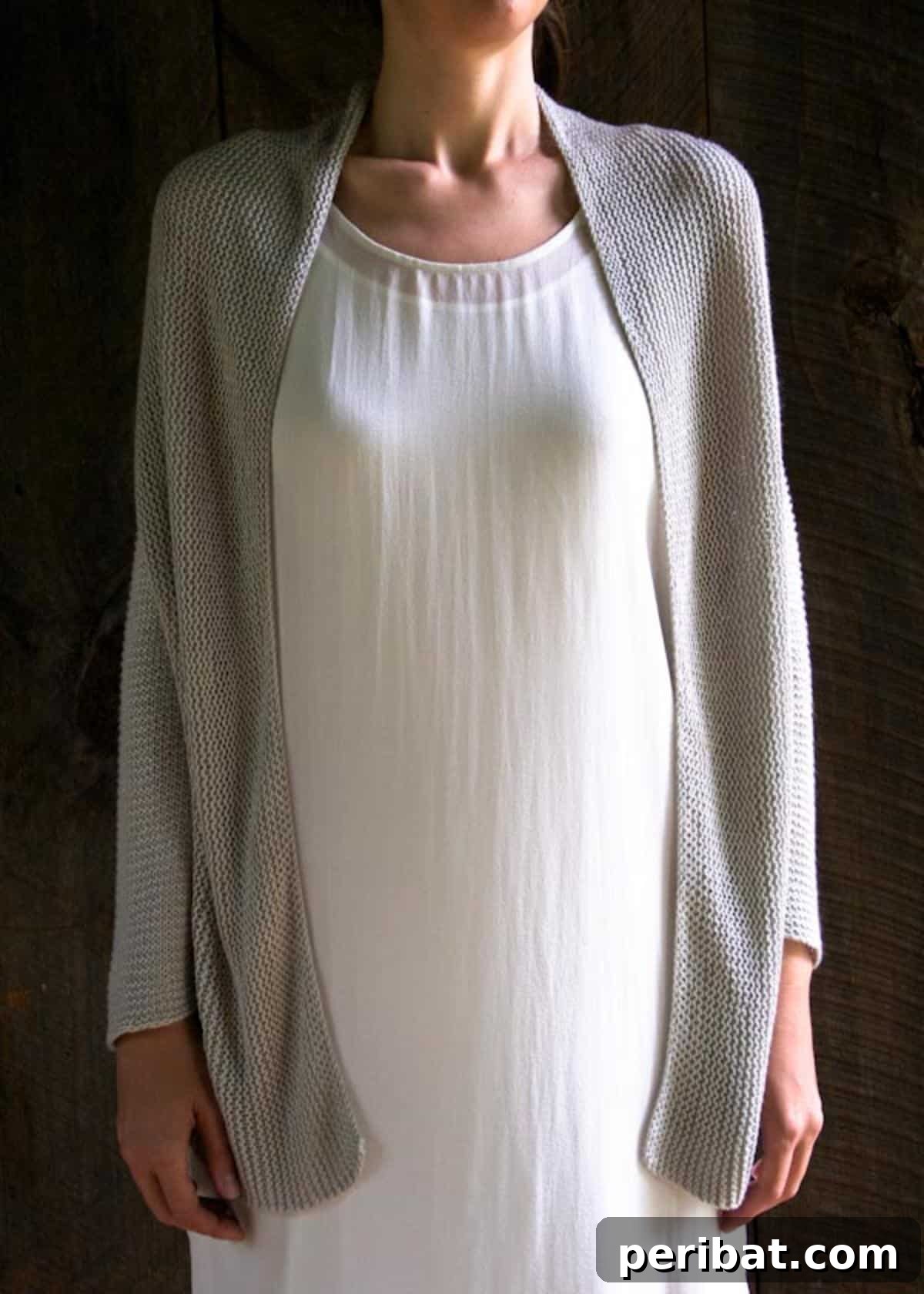 A stylish folded squares cardigan, demonstrating a unique geometric design and a flowing silhouette.