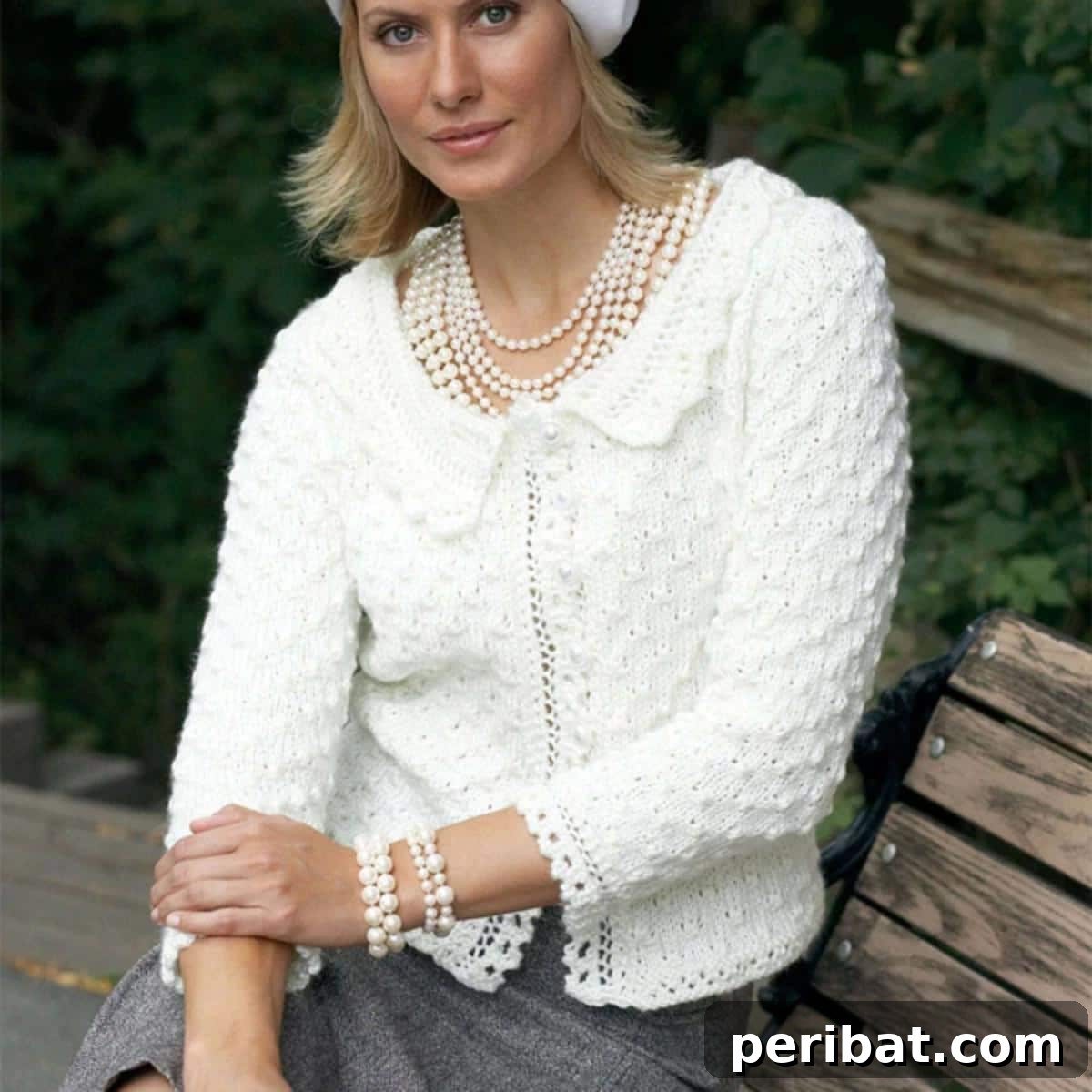 A beautiful Bernat Lace Edge Knit Cardigan, showcasing delicate lace trim along the edges for a feminine touch.