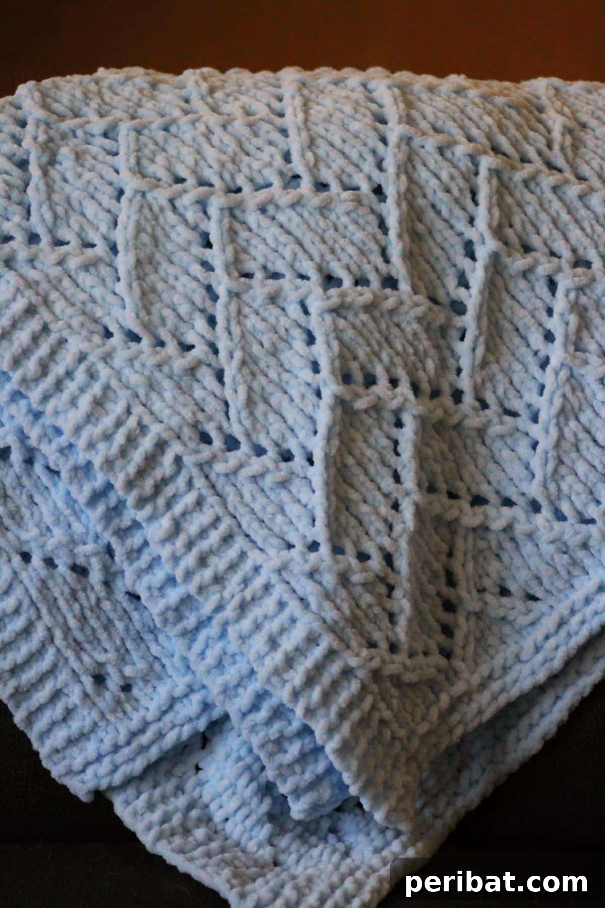 38 Adorable Baby Blanket Knitting Patterns 12 Bricklayer’s Lace Baby Blanket - a delicate blanket with an intricate lace pattern resembling brickwork.