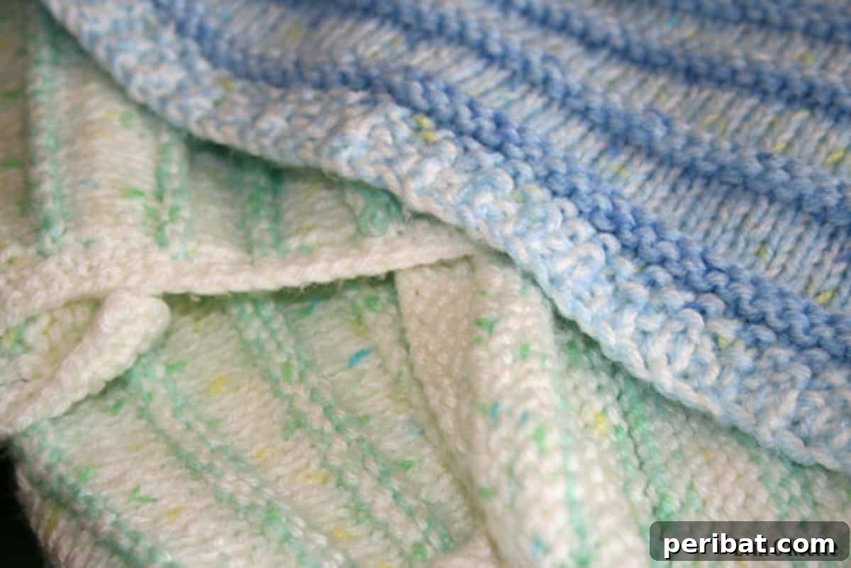 38 Adorable Baby Blanket Knitting Patterns 29 Stripy Cozy Baby Blanket - a warm and inviting blanket with colorful stripes.