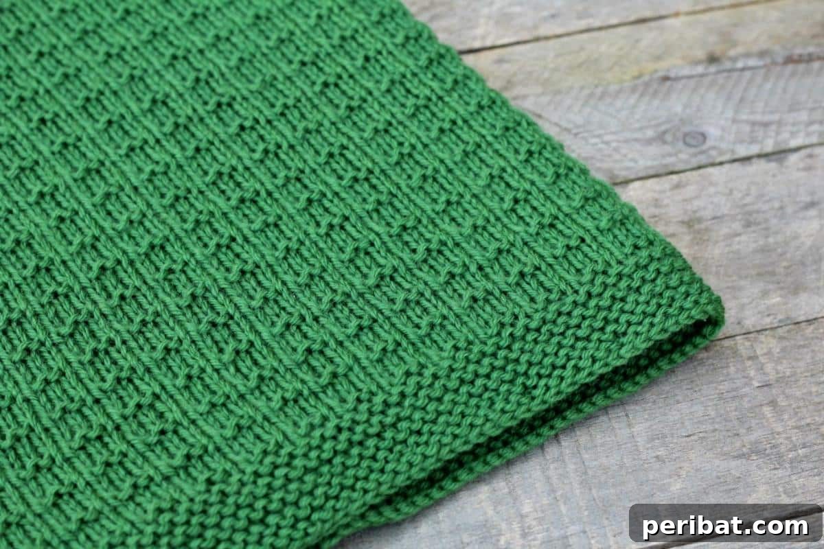 38 Adorable Baby Blanket Knitting Patterns 30 Cambrie Knit Blanket - a generously sized knitted blanket with a beautiful, intricate texture.