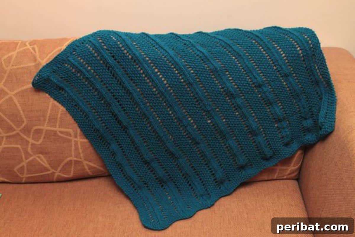 38 Adorable Baby Blanket Knitting Patterns 32 Seeds and Trees Baby Blanket - a nature-inspired blanket with textured patterns resembling seeds and trees.