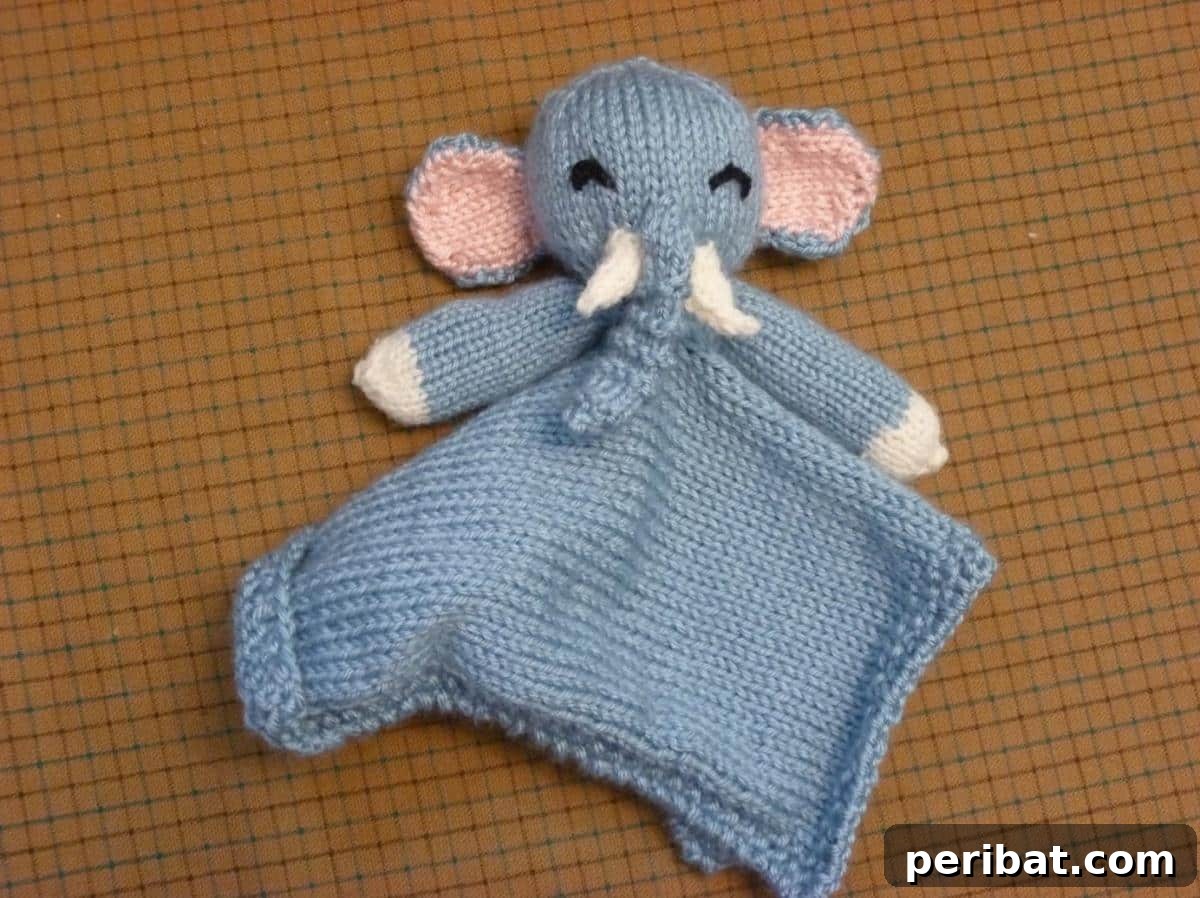 38 Adorable Baby Blanket Knitting Patterns 33 Elephant Lovie - a comforting baby blanket featuring an adorable elephant motif.