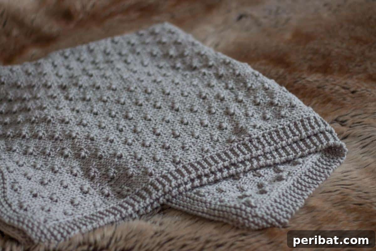 38 Adorable Baby Blanket Knitting Patterns 9 Knot Stitch Baby Blanket - a textured blanket showcasing the unique knot stitch pattern.