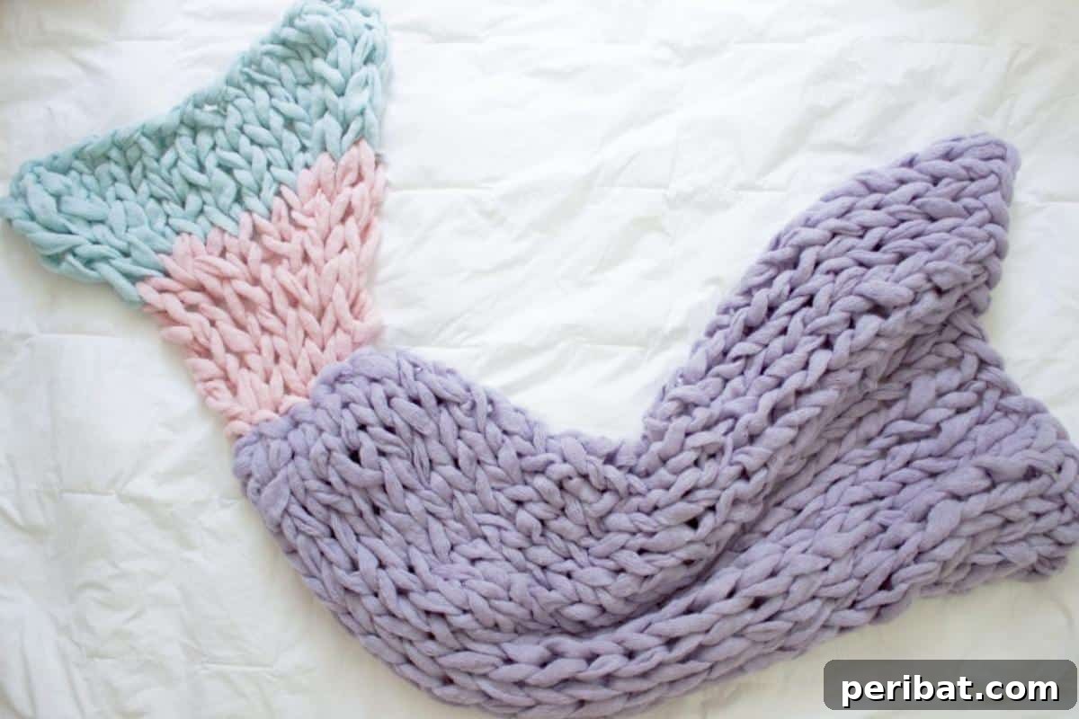 Arm Knit Mermaid Blanket, a simple and warm chunky yarn project perfect for beginners.