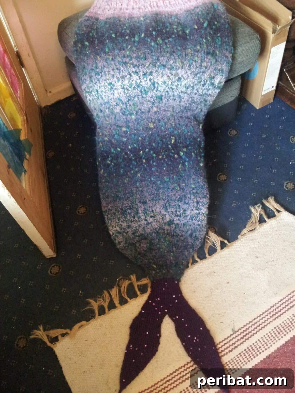 Mermaid Tail Blanket, a cozy, colorful knitting project with a clever opening for easy movement.
