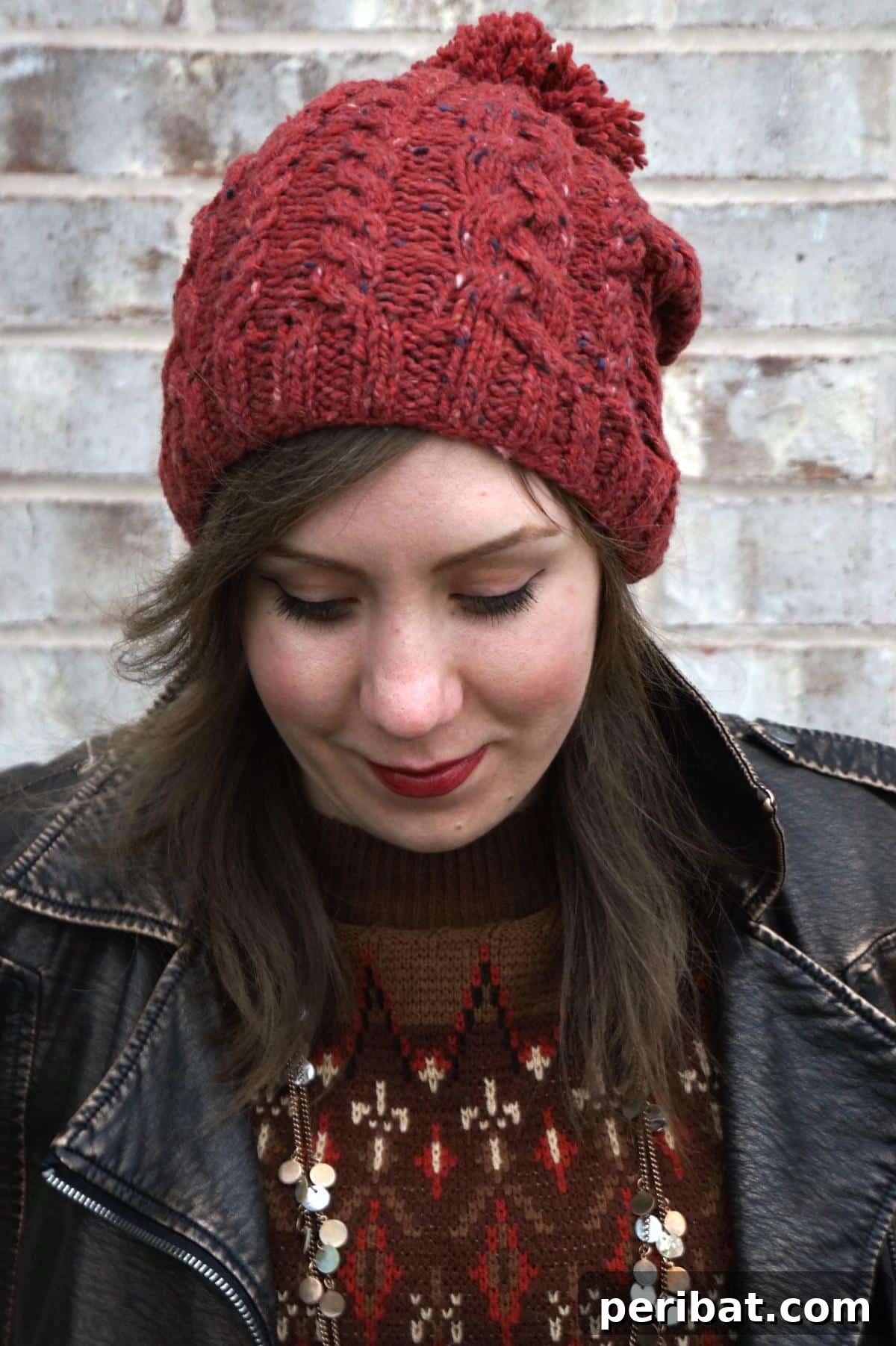 38 Cozy Slouchy Hat Knitting Patterns 28 Beginner-friendly Slouchy Cable Hat knitting pattern with a fun pom-pom, offering a gentle introduction to cables.