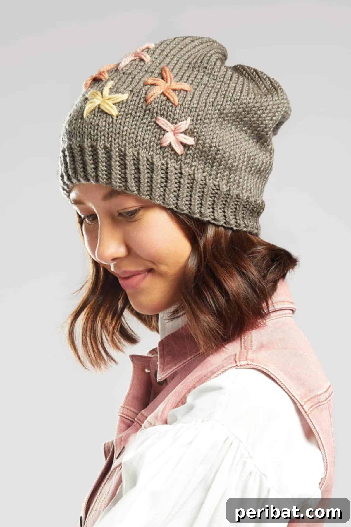 38 Cozy Slouchy Hat Knitting Patterns 4 Khaki slouchy hat knitting pattern with delicate embroidery, adding a unique personal touch.