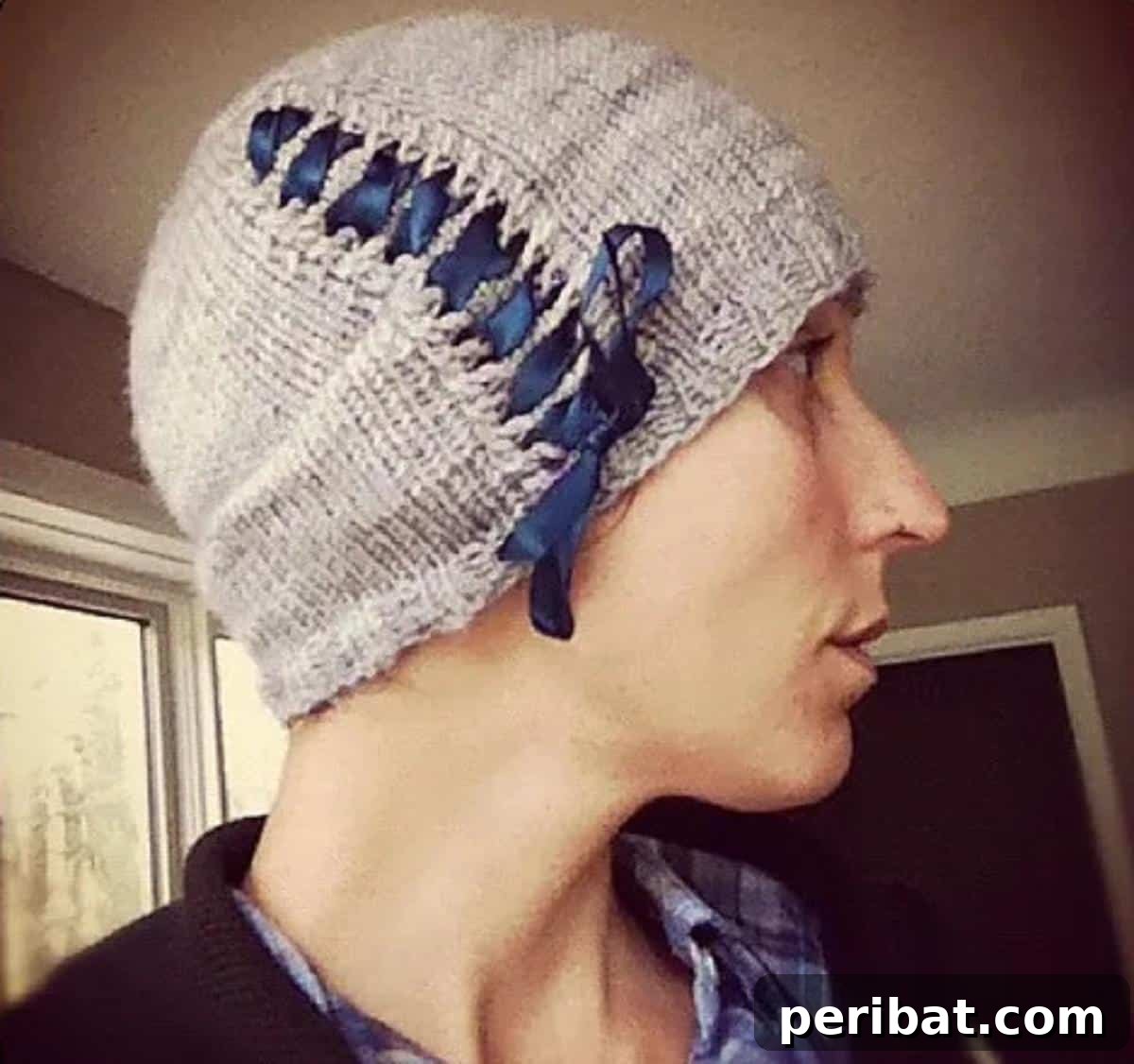 38 Cozy Slouchy Hat Knitting Patterns 32 Cinched Slouchy Hat knitting pattern, featuring a sophisticated tightened detail through eyelets for a unique modern form.