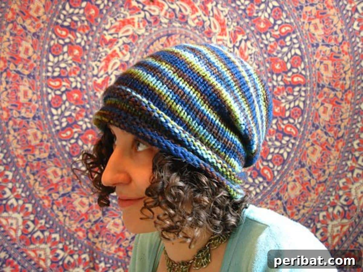 38 Cozy Slouchy Hat Knitting Patterns 36 Mountain Nights Toque knitting pattern, capturing serene mountain essence with a slightly slouchy design and ribbed bands.