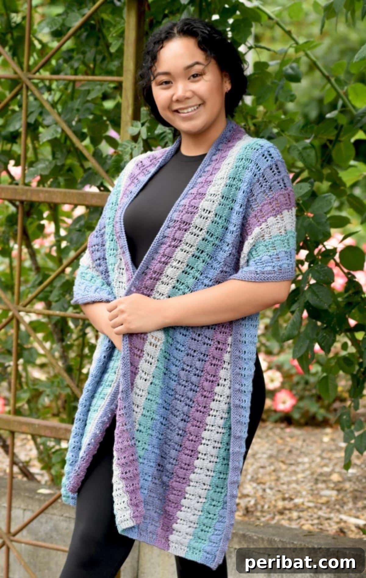 Divine Comfort: 36 Knitted Prayer Shawl Designs 11 A soft and comforting Lacy Prayer Shawl, crafted with variegated Whirligig yarn, featuring delicate lace patterns for a soothing and elegant embrace.