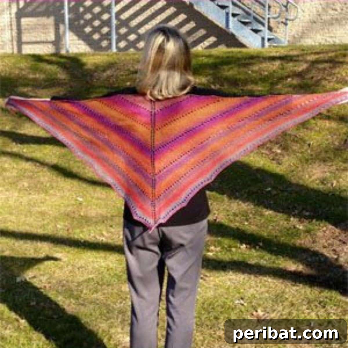 Divine Comfort: 36 Knitted Prayer Shawl Designs 16 A vibrant Painted Desert Lace Shawl, showcasing the stunning hues of a desert sunset, ideal for variegated yarns and an inexpensive yet eye-catching accessory.
