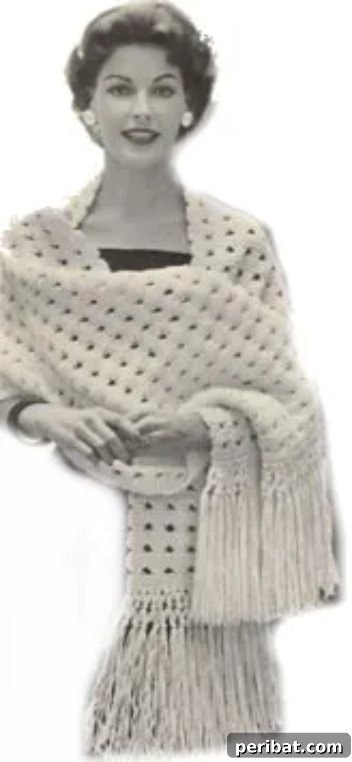 Divine Comfort: 36 Knitted Prayer Shawl Designs 17 An elegantly timeless Knitted Harmony Shawl, inspired by vintage aesthetics, crafted with worsted-weight yarn for warmth, class, and comfort.