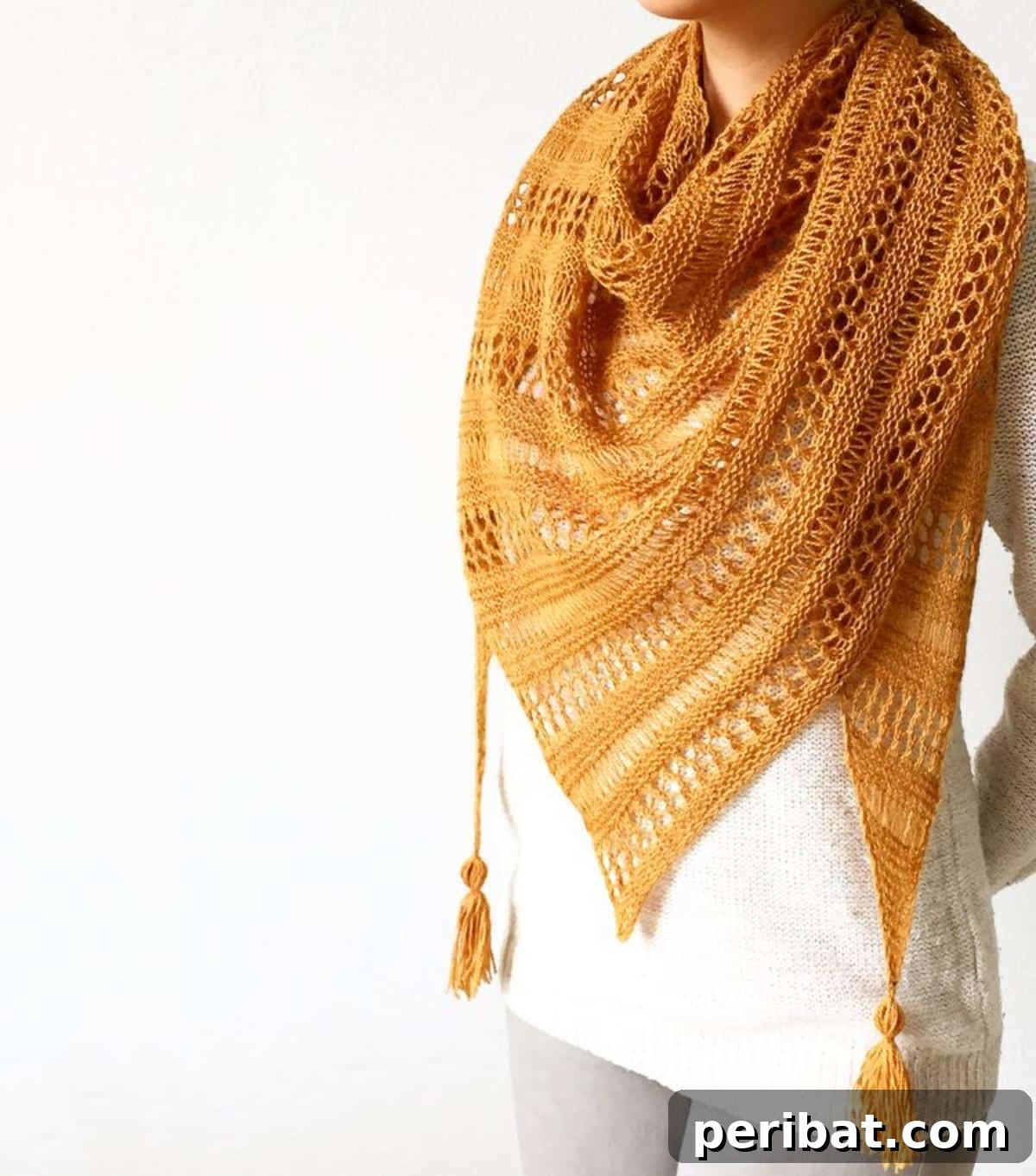 Divine Comfort: 36 Knitted Prayer Shawl Designs 23 An asymmetrical Stormy Sky Shawl, inspired by the dark, dramatic colors of stormy weather, offering a modern touch and stylish design.