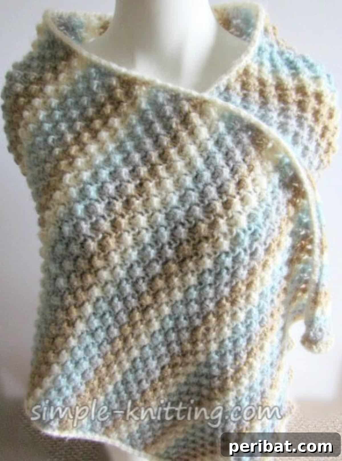 Divine Comfort: 36 Knitted Prayer Shawl Designs 25 A cozy and elegant Simple Knitted Shawl, designed for any knitter, made with soft yarn in soothing colors, offering a wearable hug for comfort and gifting.