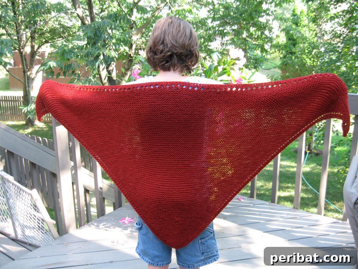 Divine Comfort: 36 Knitted Prayer Shawl Designs 26 A meaningful Triangular Prayer Shawl, knit with bulky yarn, symbolizing faith and hope, offering deep comfort and connection.