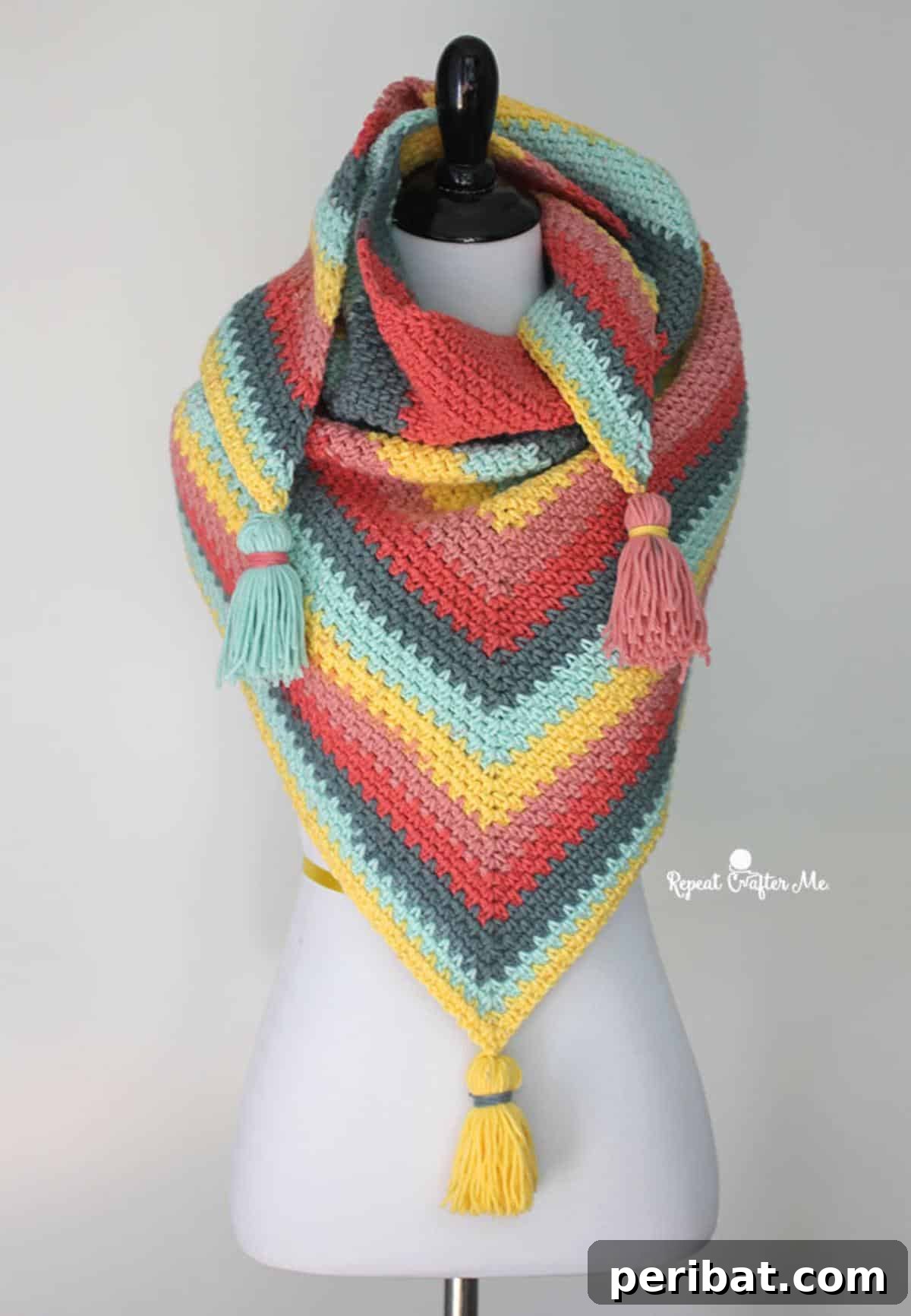Divine Comfort: 36 Knitted Prayer Shawl Designs 29 A vibrant and customizable Cozy Colorful Wrap, made from self-striping yarn with a reversible moss stitch texture, perfect for any ensemble.