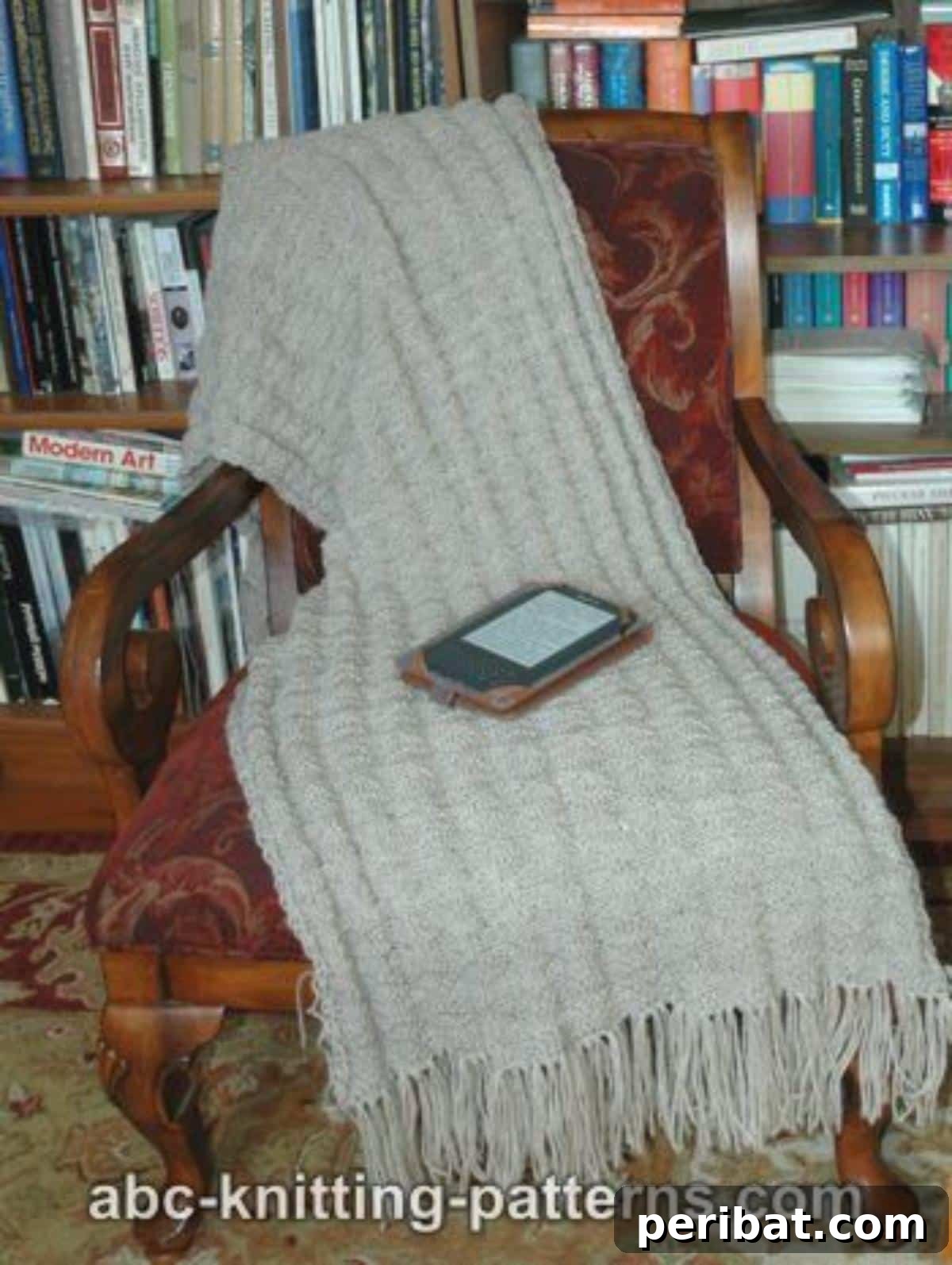 Divine Comfort: 36 Knitted Prayer Shawl Designs 5 A stylish and comforting Fluted Prayer Shawl, crafted from warm woolen yarn with a distinctive, elegant fluted design that adds texture and visual interest.
