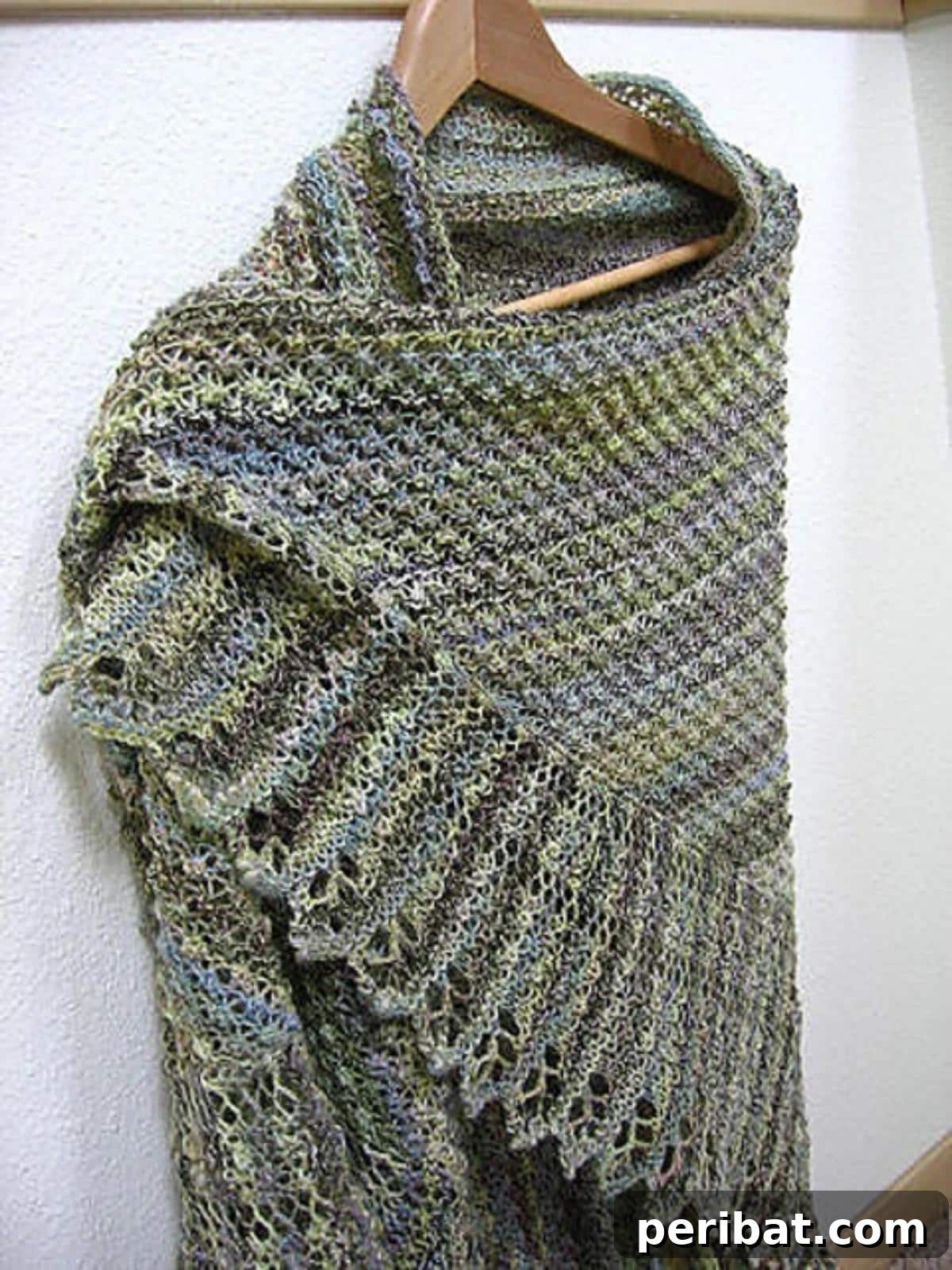 Divine Comfort: 36 Knitted Prayer Shawl Designs 6 A stunning triangular Trinity Stitch Shawl, starting simply and gracefully unfolding into an elegant design that highlights the unique texture of the Trinity stitch.