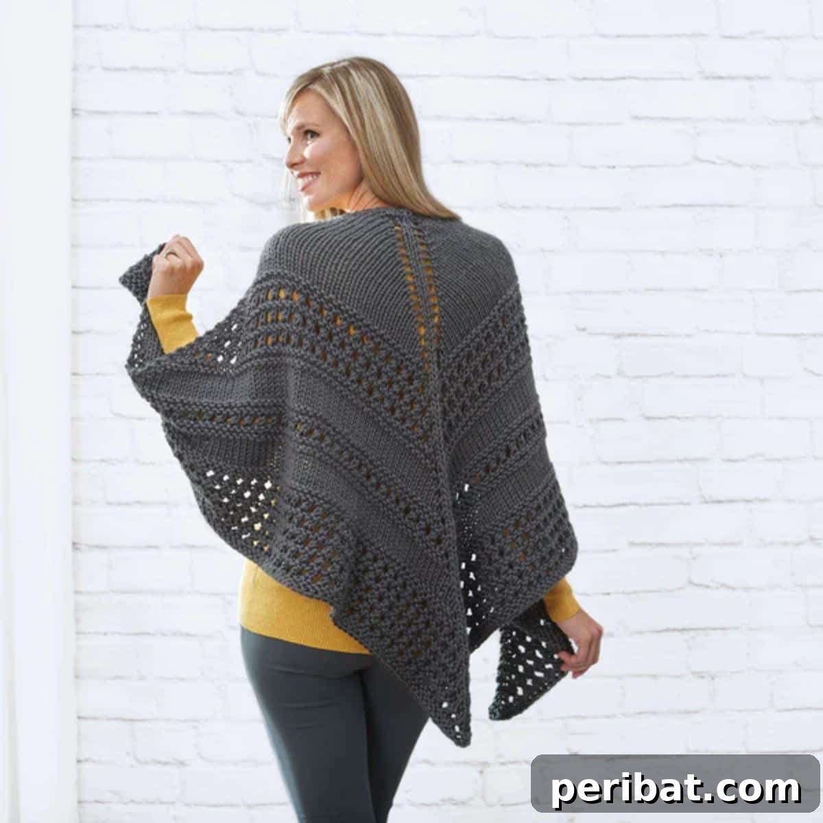 Divine Comfort: 36 Knitted Prayer Shawl Designs 8 An eye-catching Red Heart Textured Triangle Shawl, featuring a rich texture and versatile design, knitted with thick yarn for a quick and cozy result.