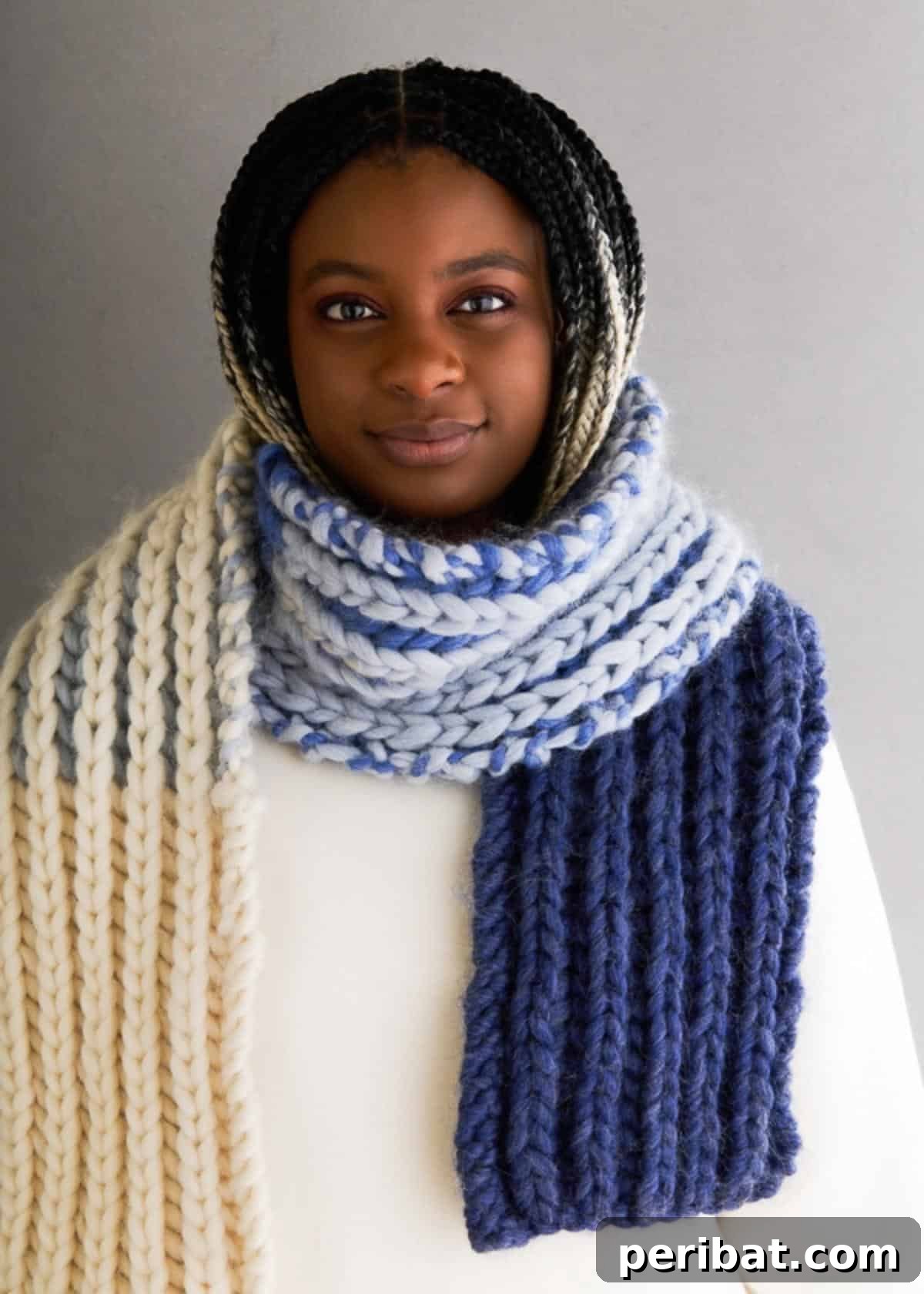 Brioche Gradient Scarf, showcasing a smooth transition of colors within the deep texture of the brioche stitch, made with super bulky yarn.