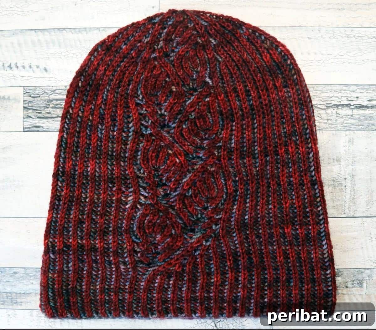 Foliage Brioche Hat, a nature-inspired brioche hat featuring elegant foliage patterns woven into a cozy rib stitch.