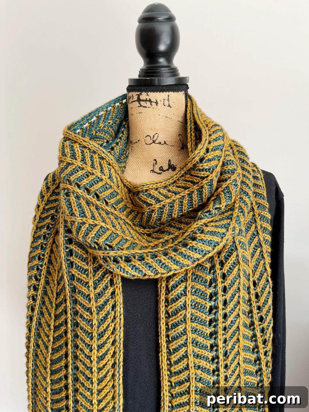 Brioche Scarf, an intermediate brioche knitting pattern showcasing a rhythmic two-row repeat and a striking two-color design.