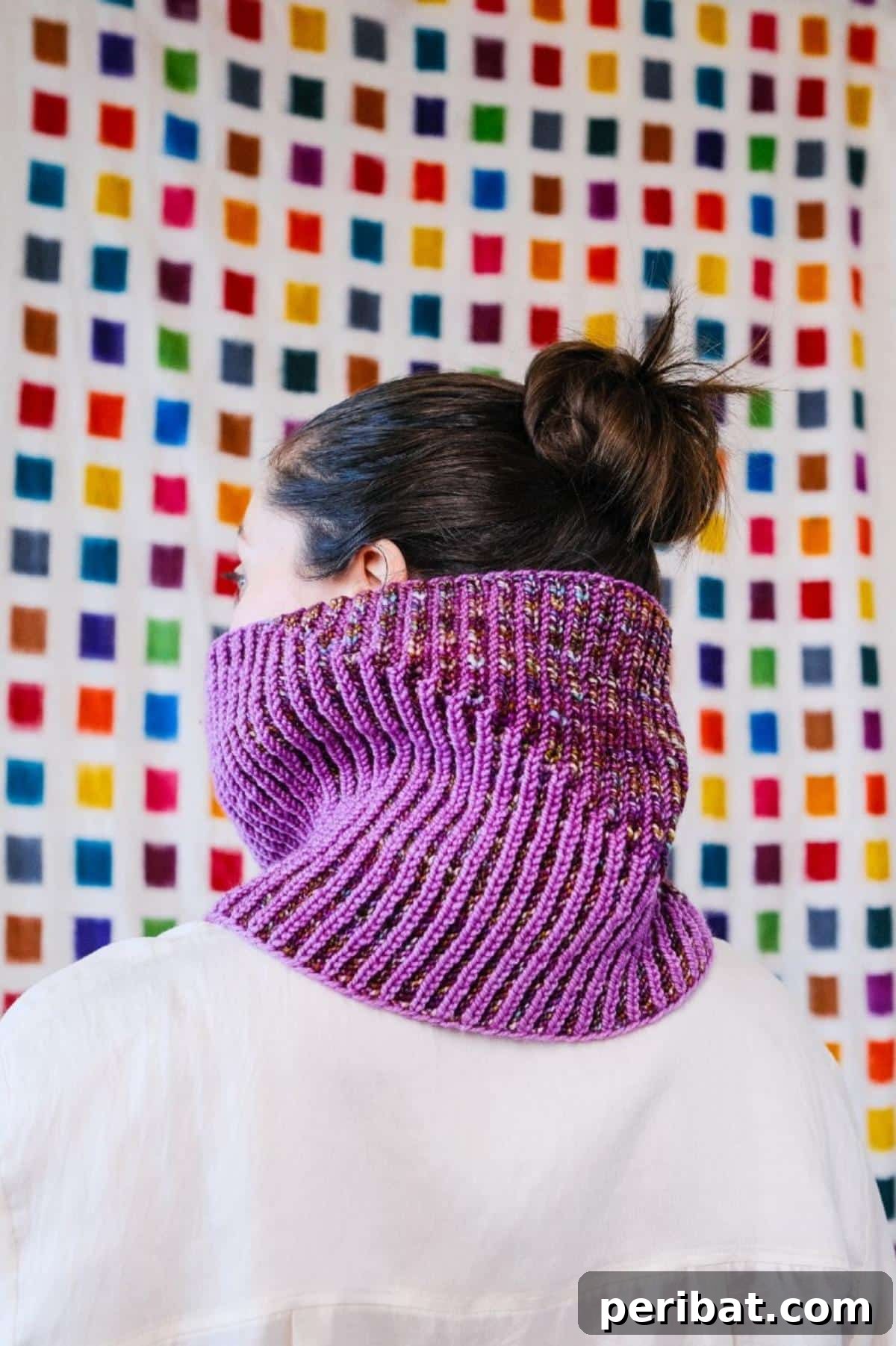 Orbit Cowl, featuring a swirling marled effect created by mixing colors in a simple brioche pattern.