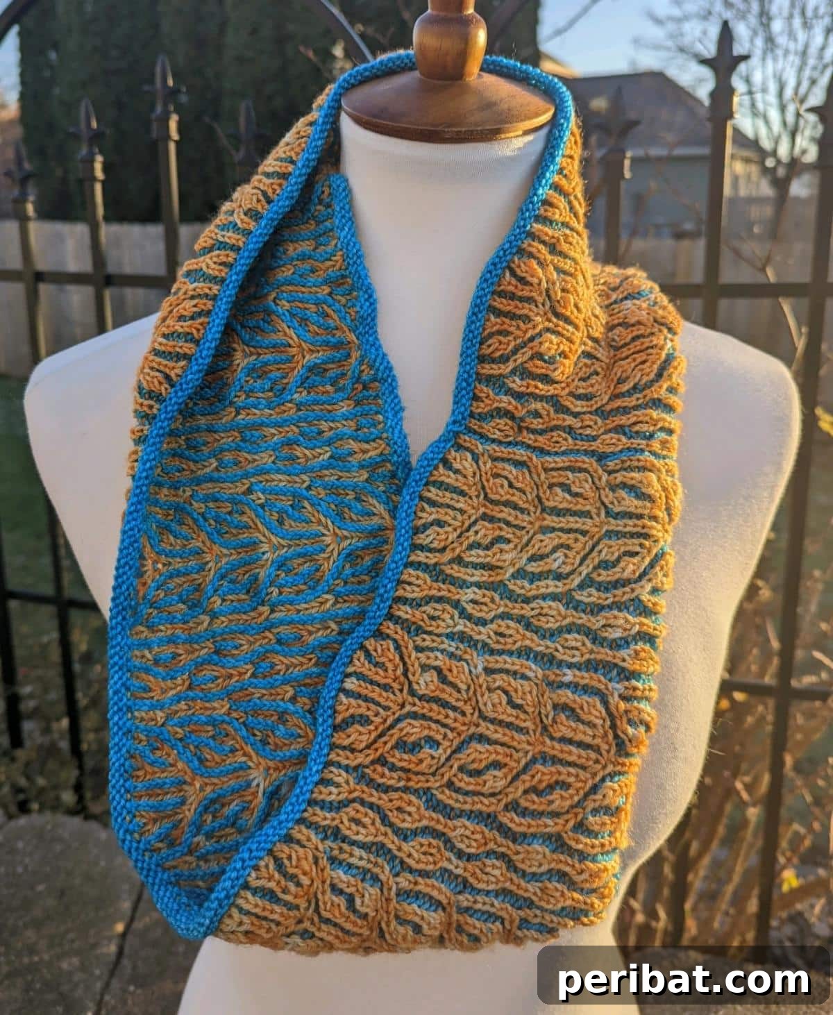 Snowfire Shawl, a cozy brioche shawl with a striking flame-like motif and contrasting colors, perfect for cold days.