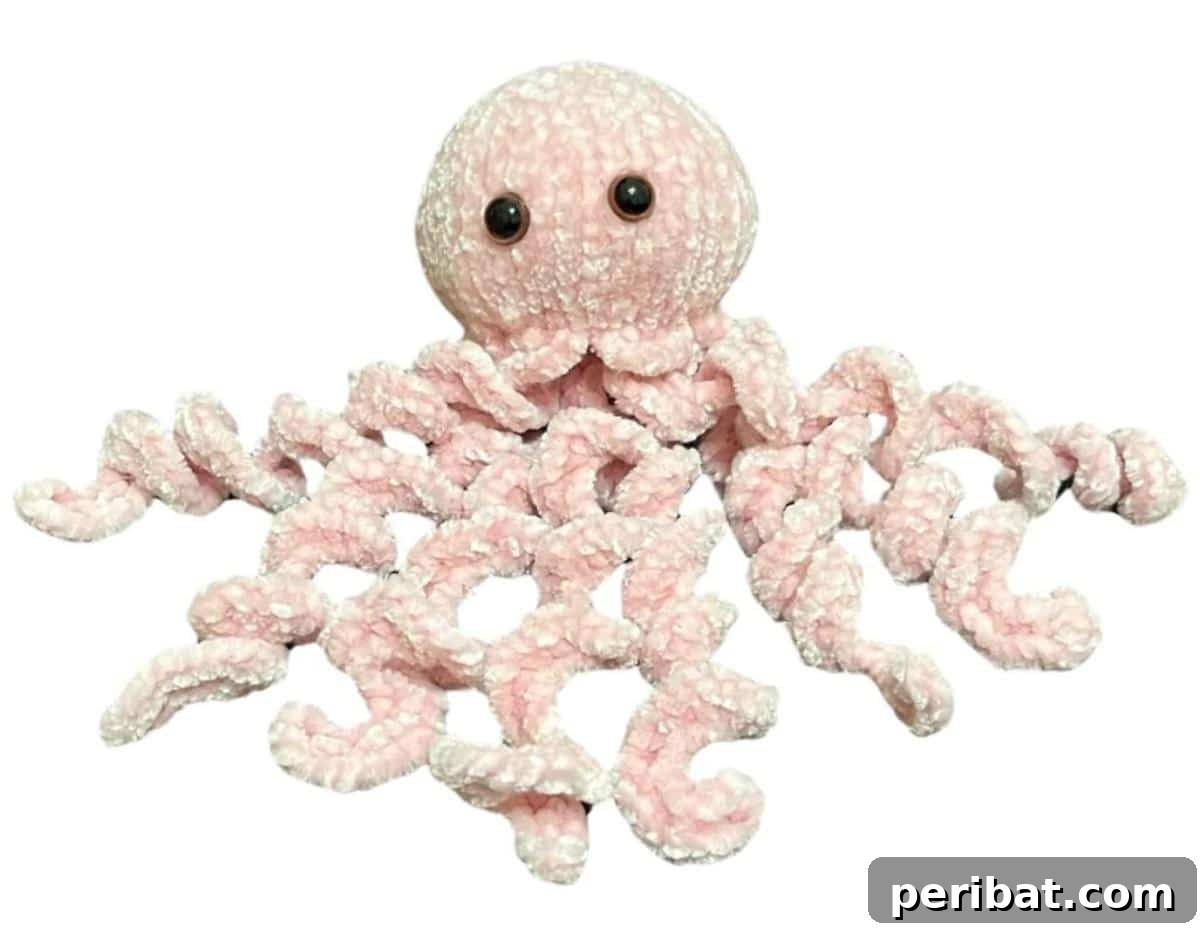 18 Timeless Aran Knitting Patterns 11 Octopus Plush Toy, a cute knitted jellyfish toy.