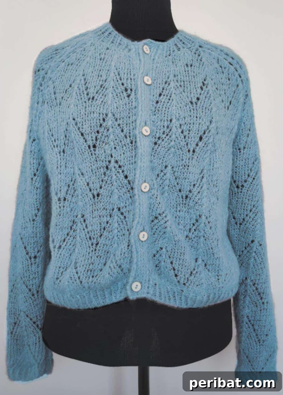 18 Timeless Aran Knitting Patterns 6 The Light Openwork Cardigan with geometric patterns.