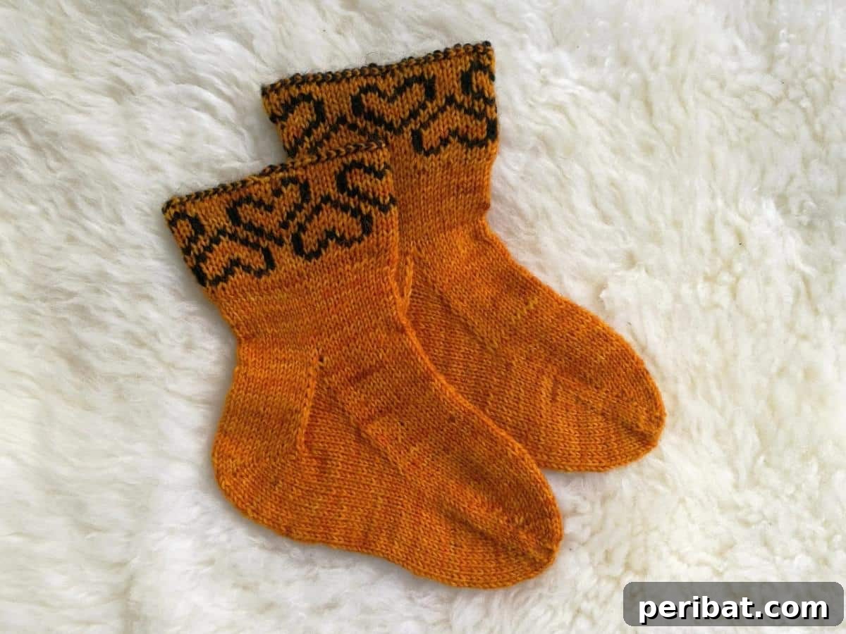 18 Creative Double Knitting Designs 5 Heart Baby Socks. Adorable toe-up baby socks with reversible cuff, adaptable for magic loop or DPNs, using fingering weight yarn.