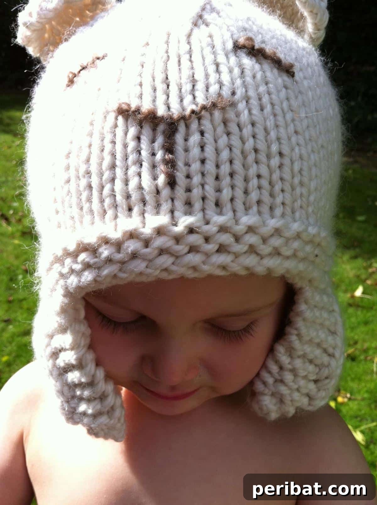32 Cozy Ear Flap Hat Knitting Designs 27 An adorable Sleepy Polar Bear Hat for babies, made with super bulky yarn and featuring cute bear ears.