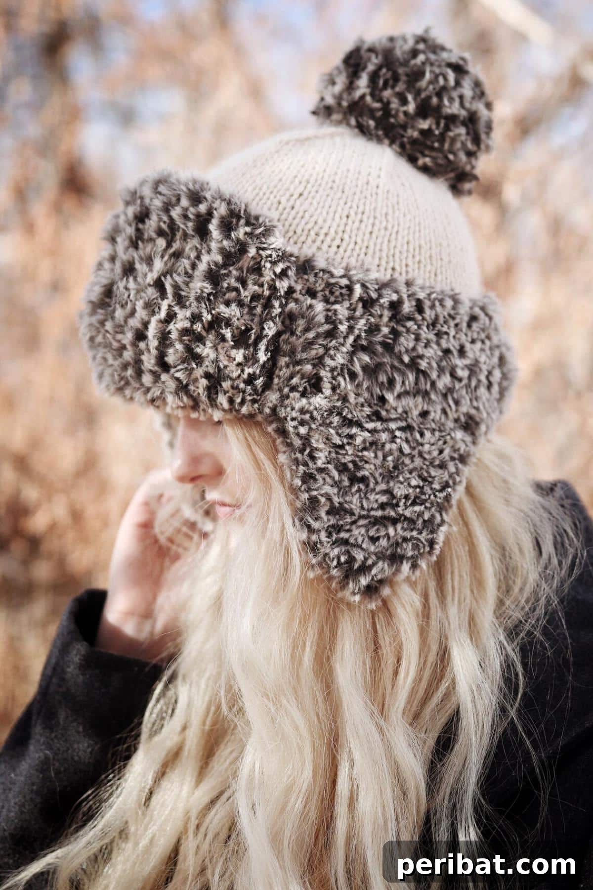 32 Cozy Ear Flap Hat Knitting Designs 31 A luxurious Trapper Hat with a plush faux-fur brim, offering superior warmth and a sophisticated design.