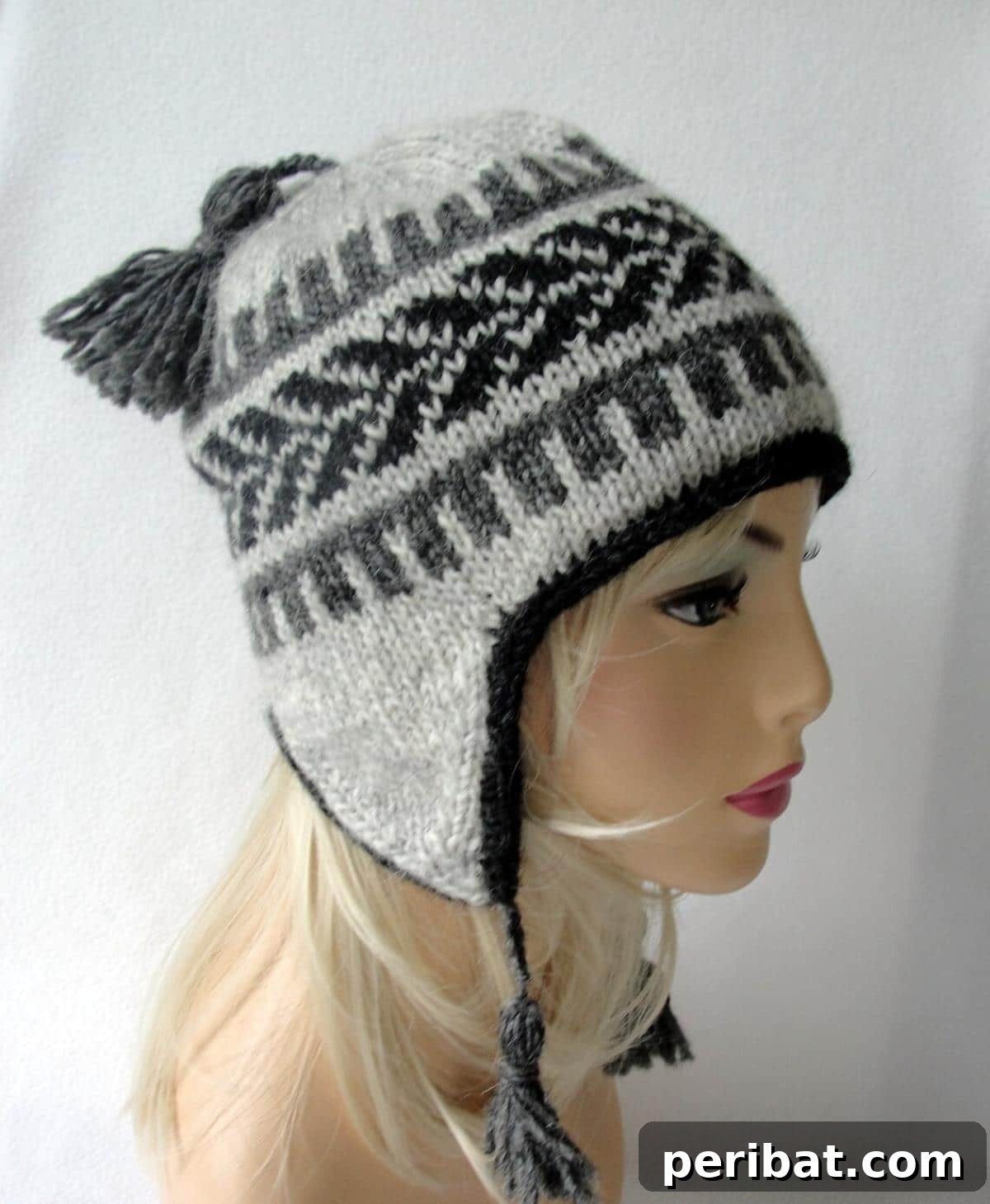 32 Cozy Ear Flap Hat Knitting Designs 32 A vibrant knit beanie with ear flaps, featuring intricate Fair Isle stranded colorwork.