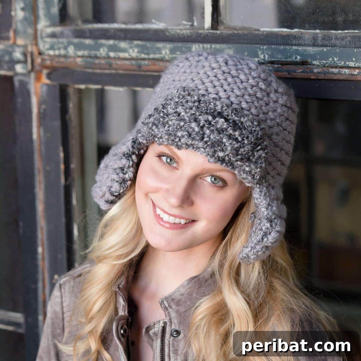 32 Cozy Ear Flap Hat Knitting Designs 8 A unisex Red Heart Mixed Aviator Hat, showcasing a blend of colorful yarns for a unique look.