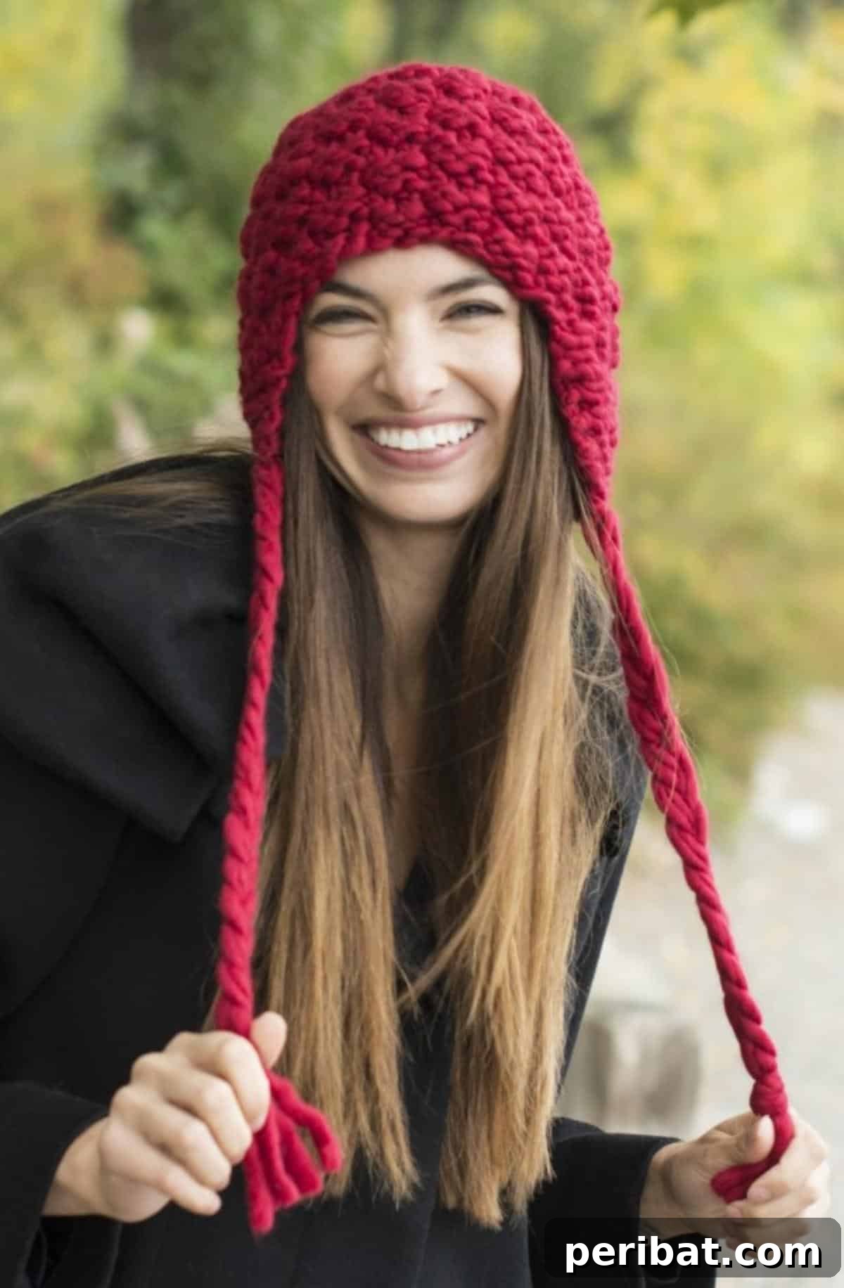 32 Cozy Ear Flap Hat Knitting Designs 9 A stylish Grande Ear Flap Hat featuring long, cascading tassels that add bohemian charm.