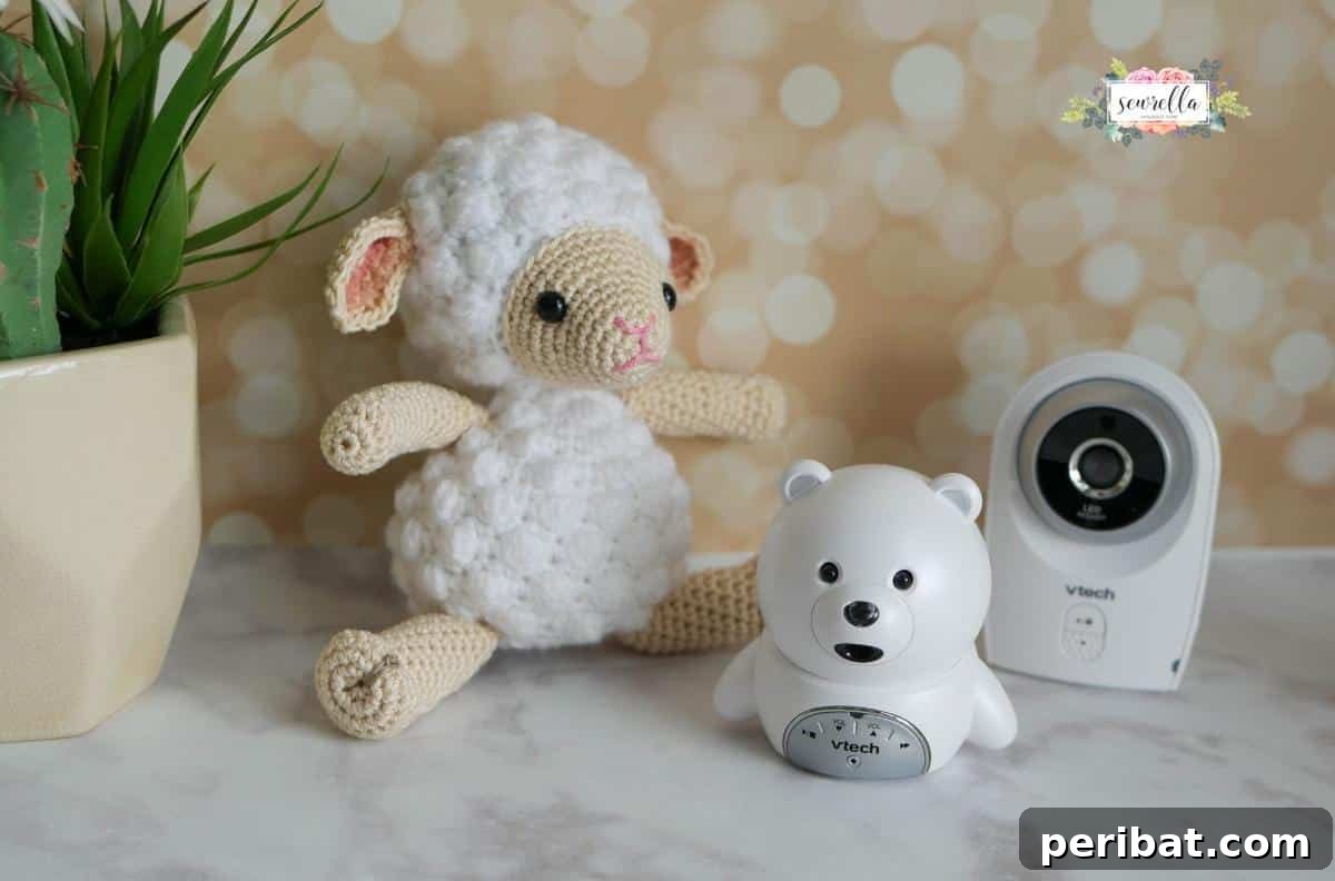 A small, fluffy amigurumi Little Crochet Lamb.
