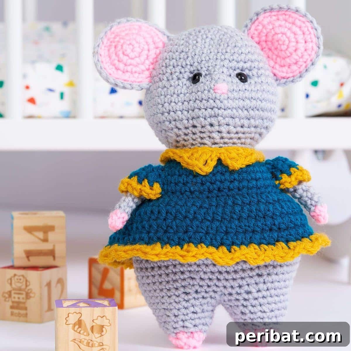 Milly the Mouse, a cute amigurumi crochet toy with button eyes and a rosy nose.