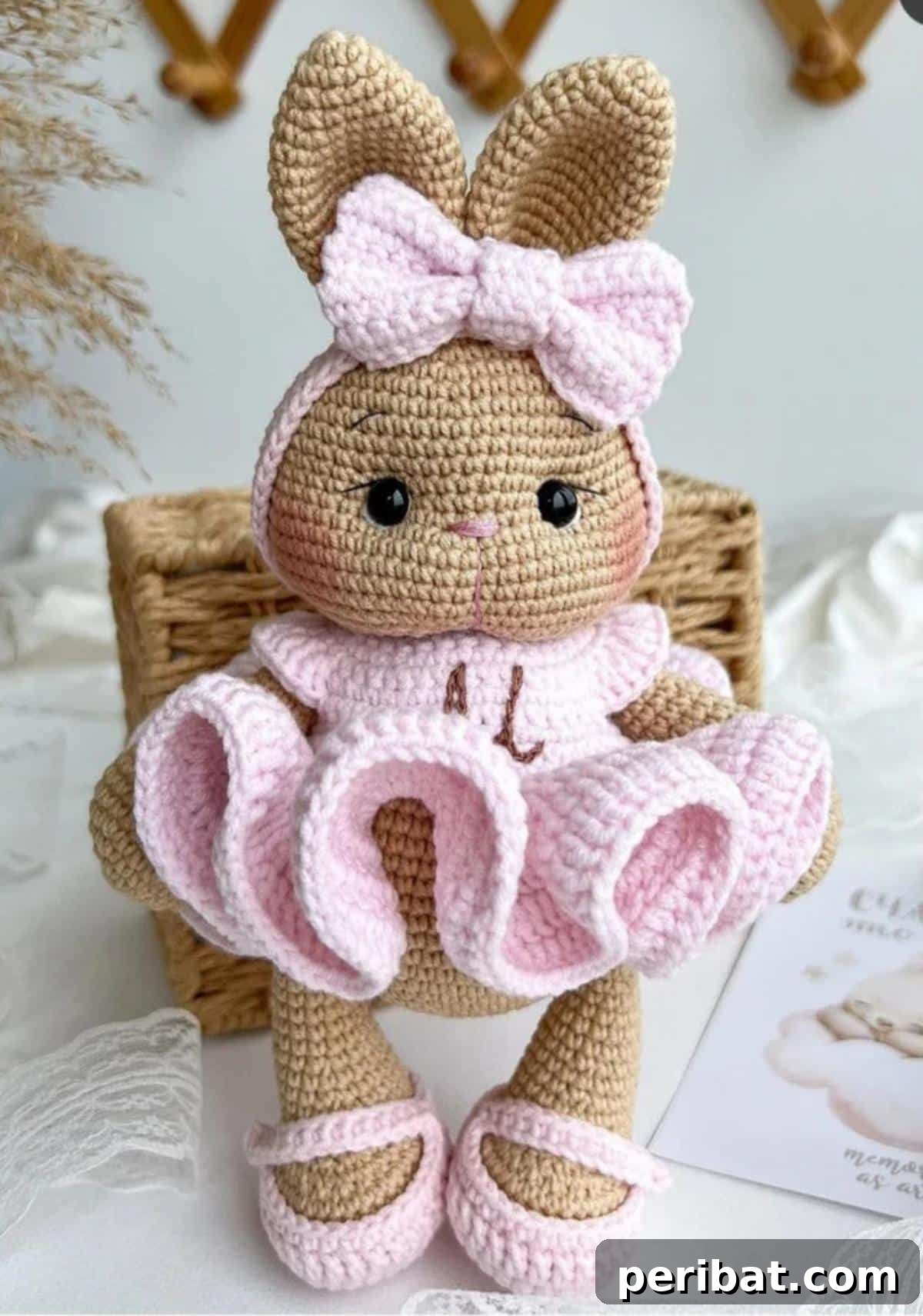 A gracefully posed amigurumi Crochet Sweet Bunny Ballerina in a puffy pink dress.