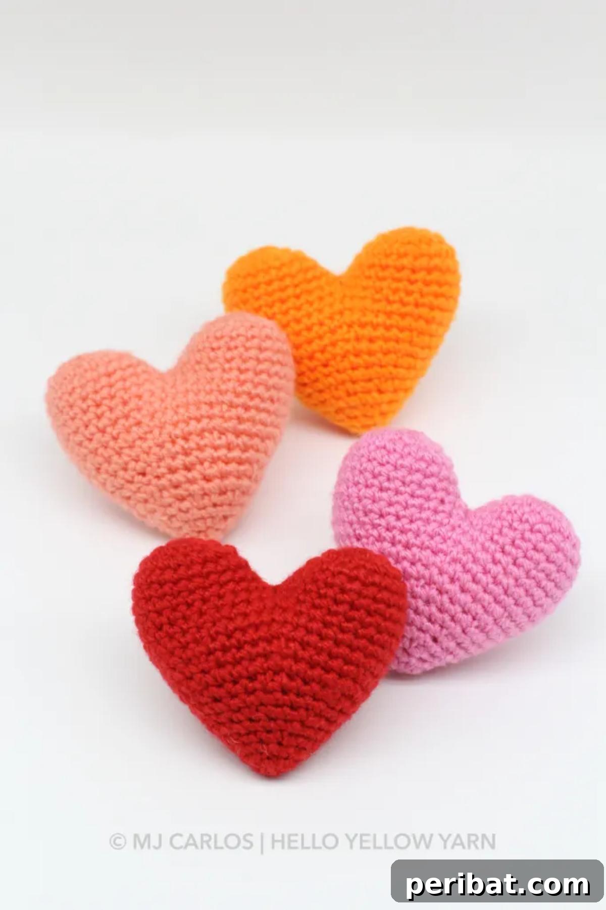 33 Cuddly Amigurumi Friends to Crochet 13 A pile of soft, cuddly amigurumi hearts in various shades of pink and red, perfect for expressing love.