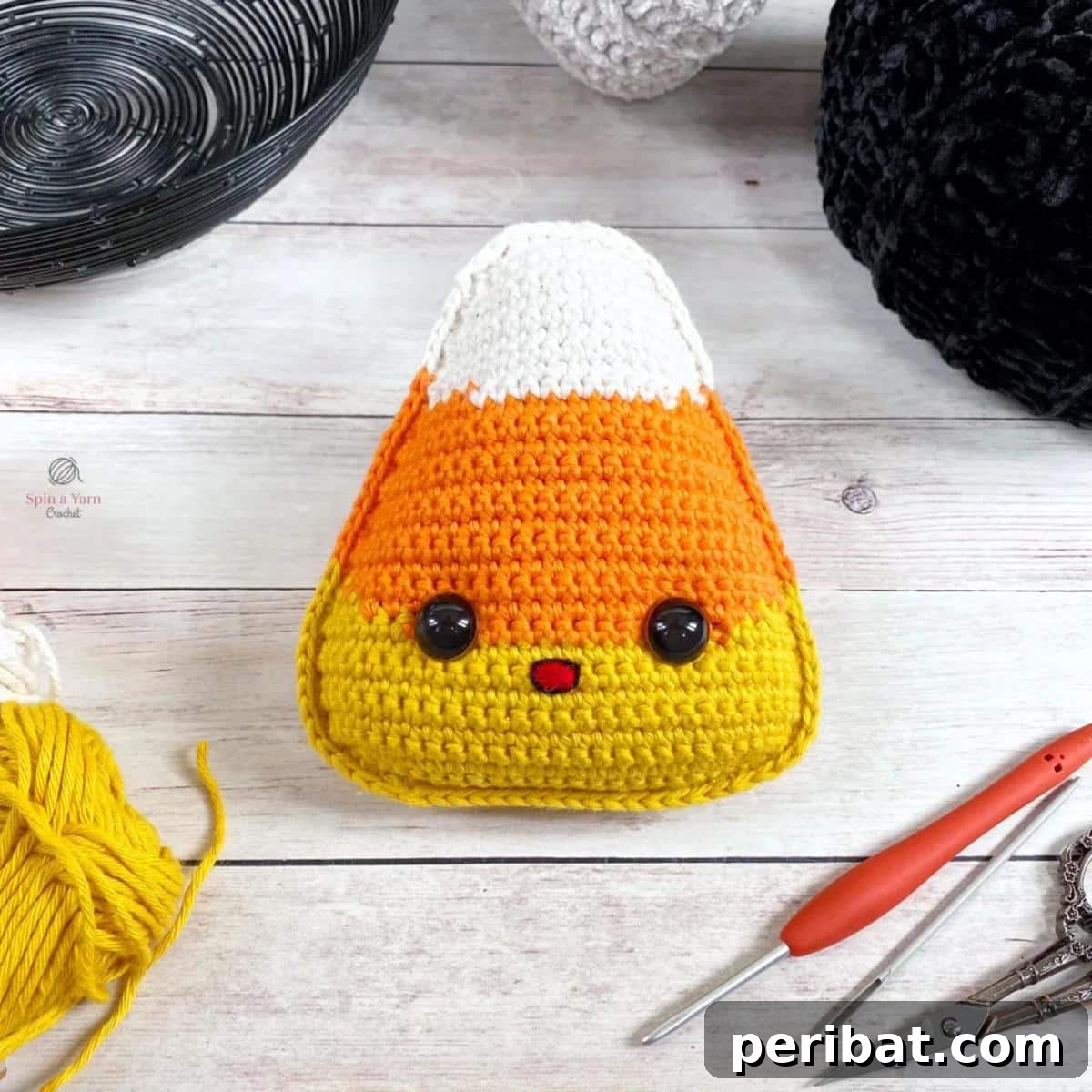 33 Cuddly Amigurumi Friends to Crochet 16 A festive group of candy corn amigurumi, showcasing the iconic white, orange, and yellow layers.