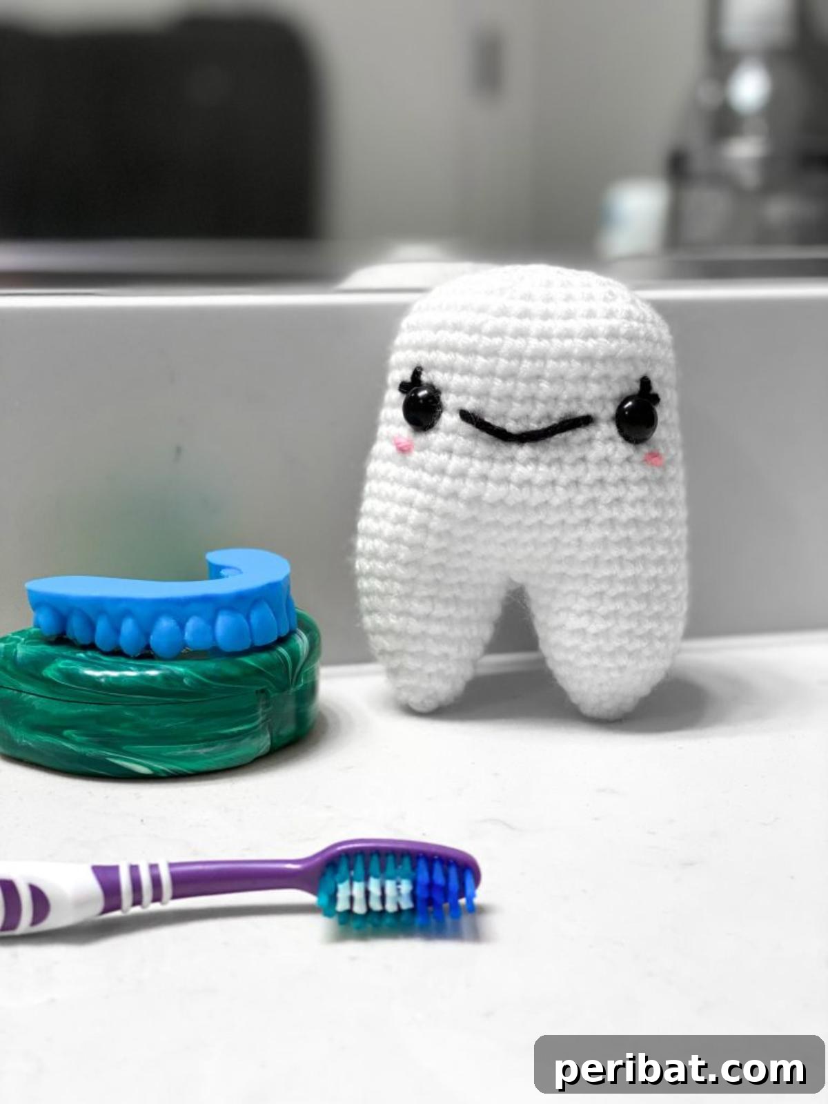 33 Cuddly Amigurumi Friends to Crochet 18 A grinning crochet tooth amigurumi, looking surprisingly cute and friendly.