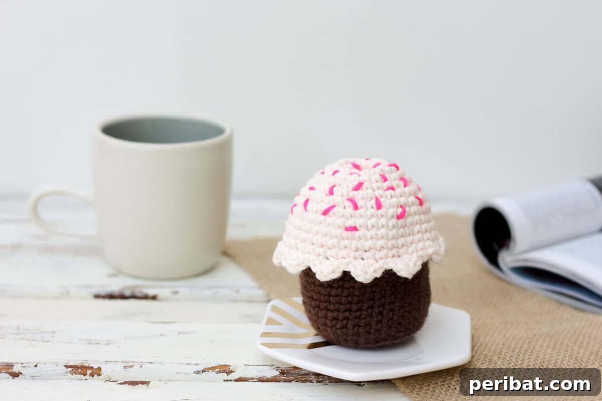 33 Cuddly Amigurumi Friends to Crochet 20 A delightful amigurumi crochet cupcake, topped with fluffy frosting and a tiny birthday candle.